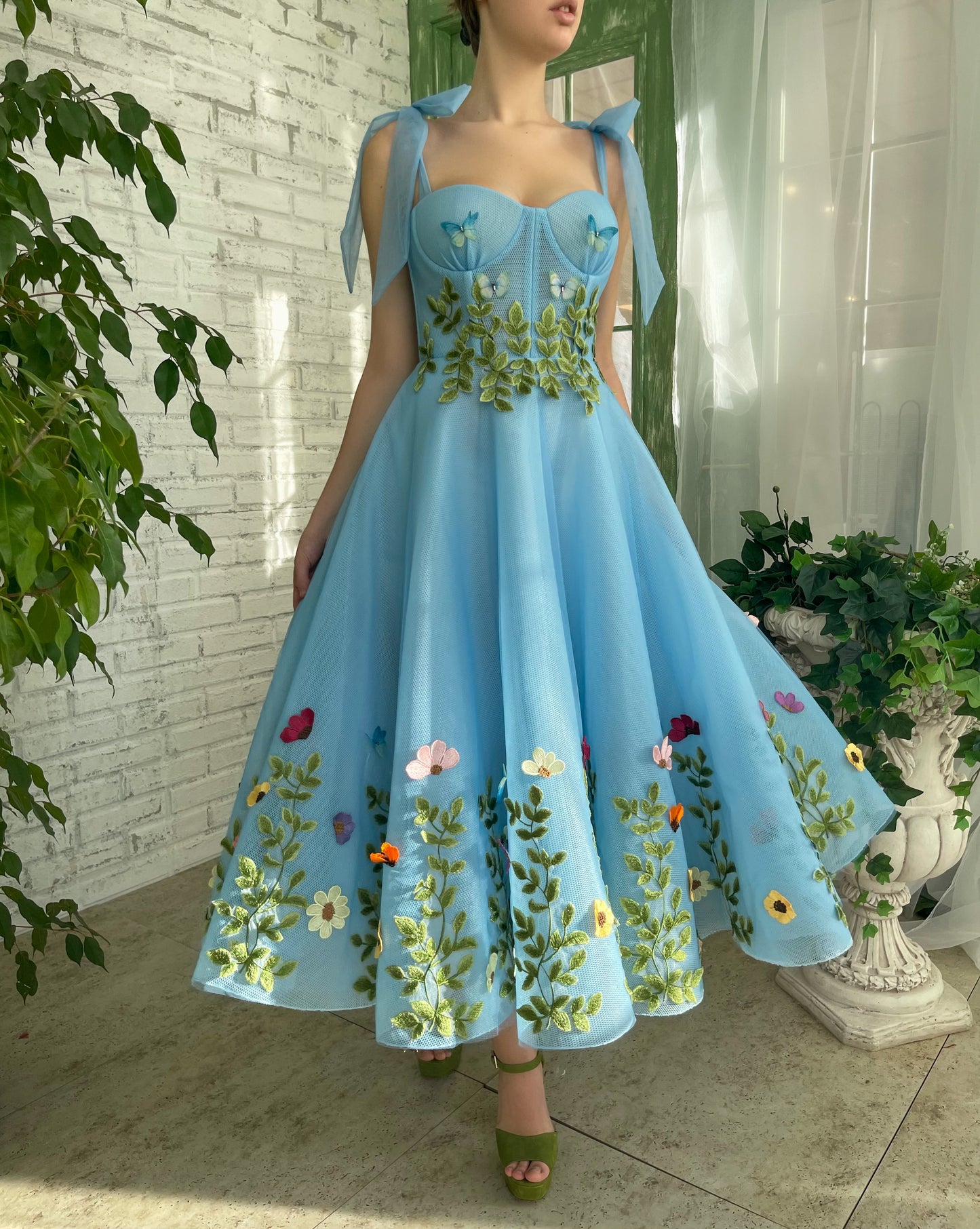 Blue midi dress with bow straps and embroidery