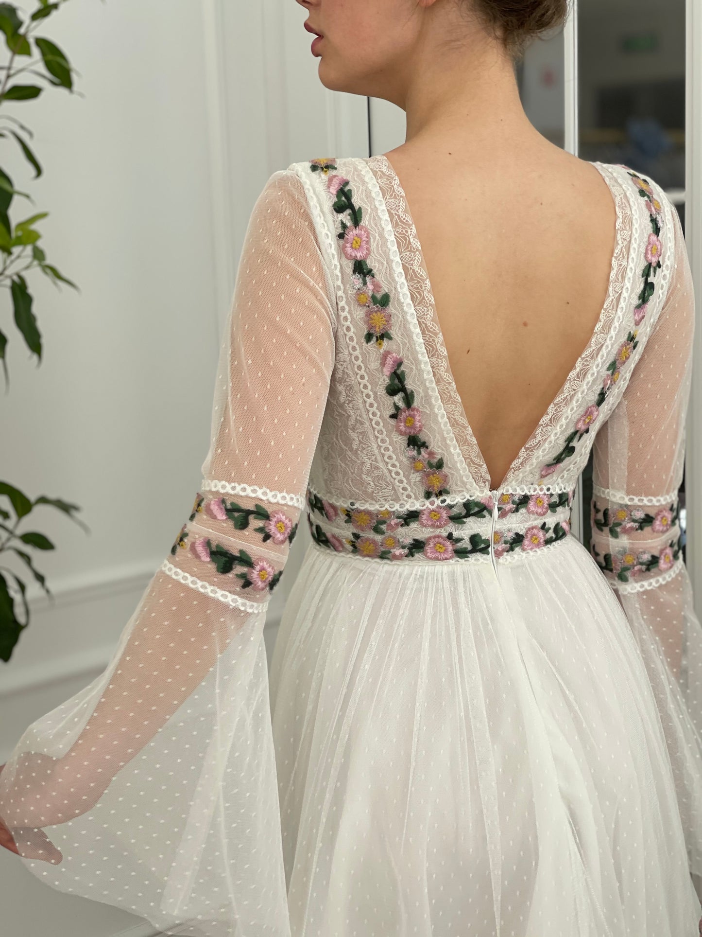 A Line white bridal dress with v-neck, long sleeves and embroidered flowers