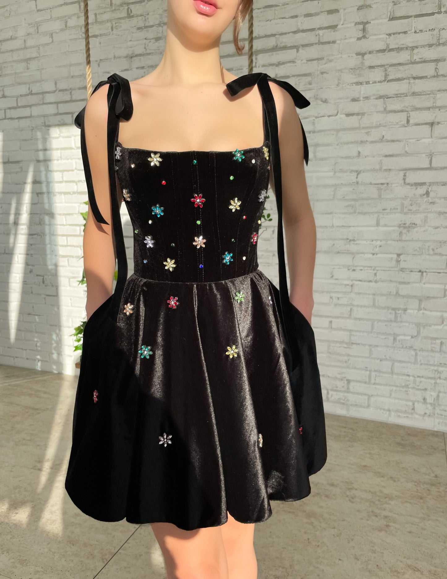 Black mini dress with bow straps and embroidery