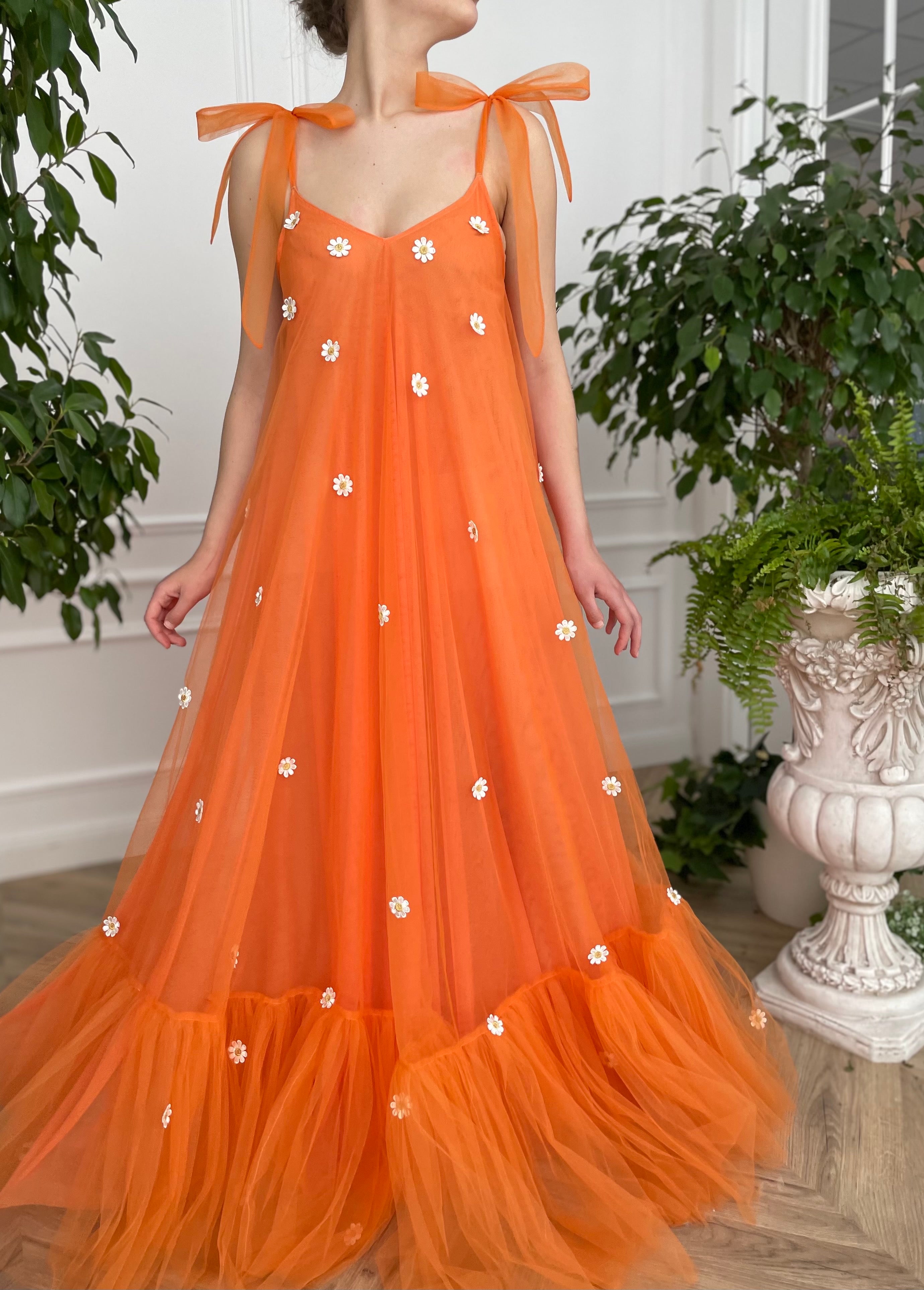 Orange sheath dress with embroidered daisies and bow straps