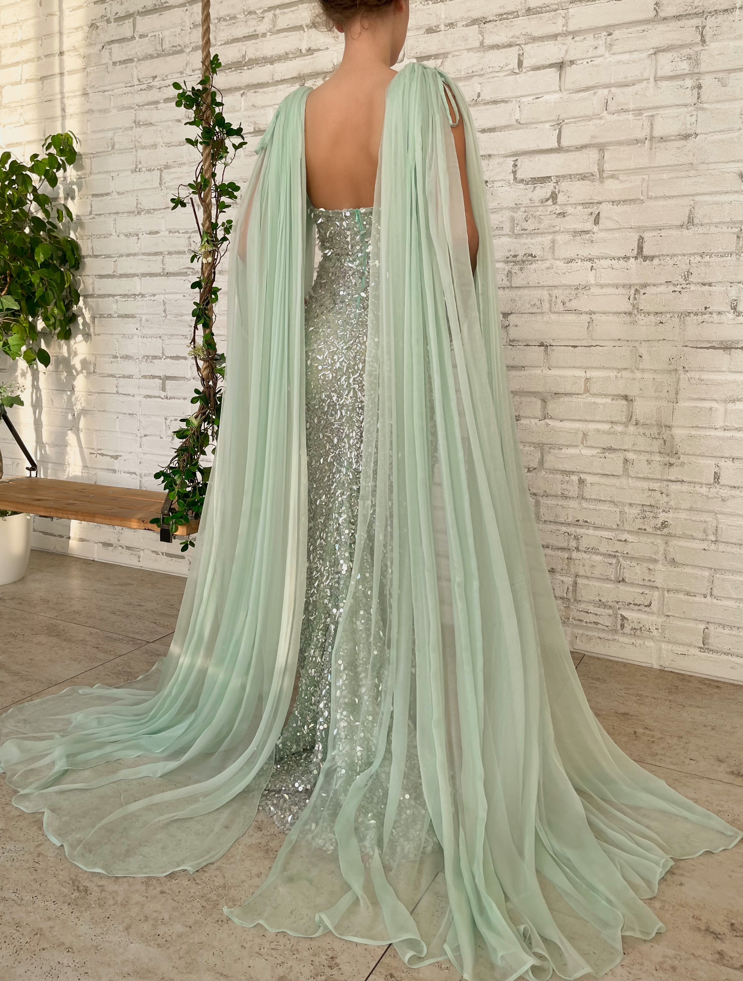 Green mermaid dress with cape sleeves and v-neck