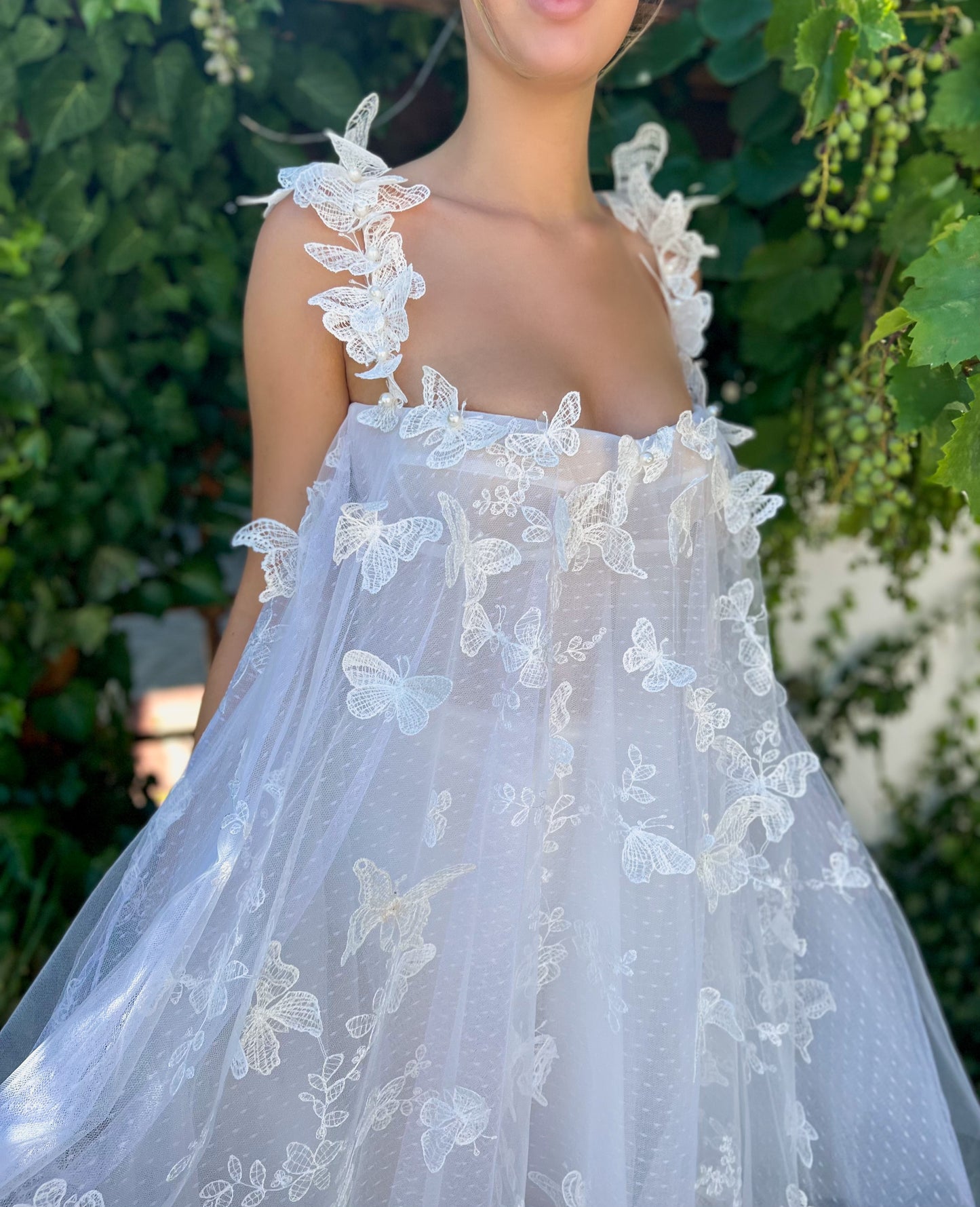 White mini dress with spaghetti straps, embroidery and butterflies