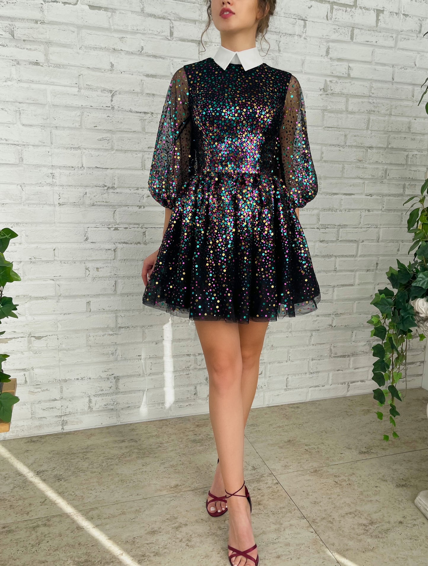 Black mini dress with sequins and short sleeves