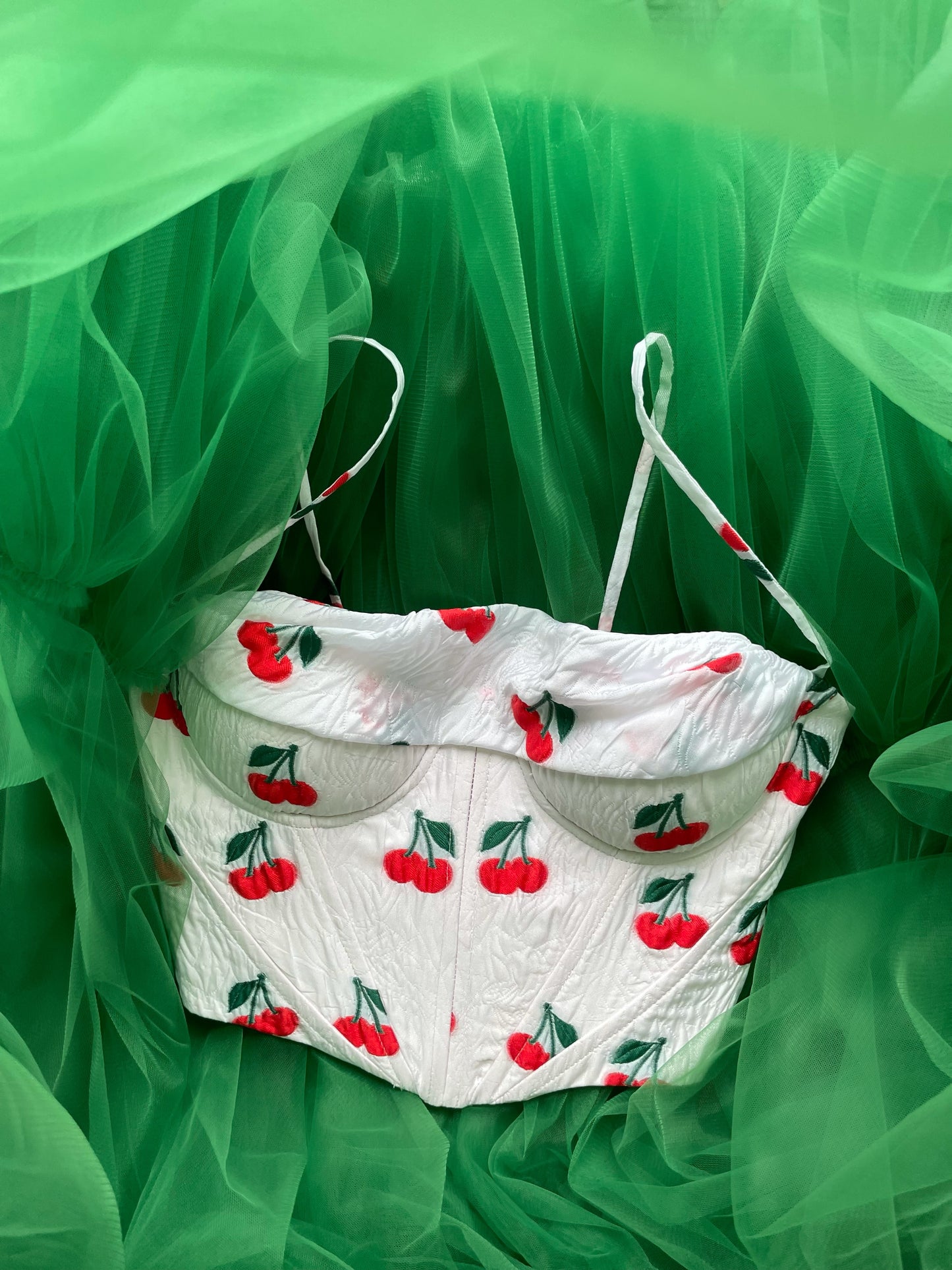 White corset with spaghetti straps and printed cherries