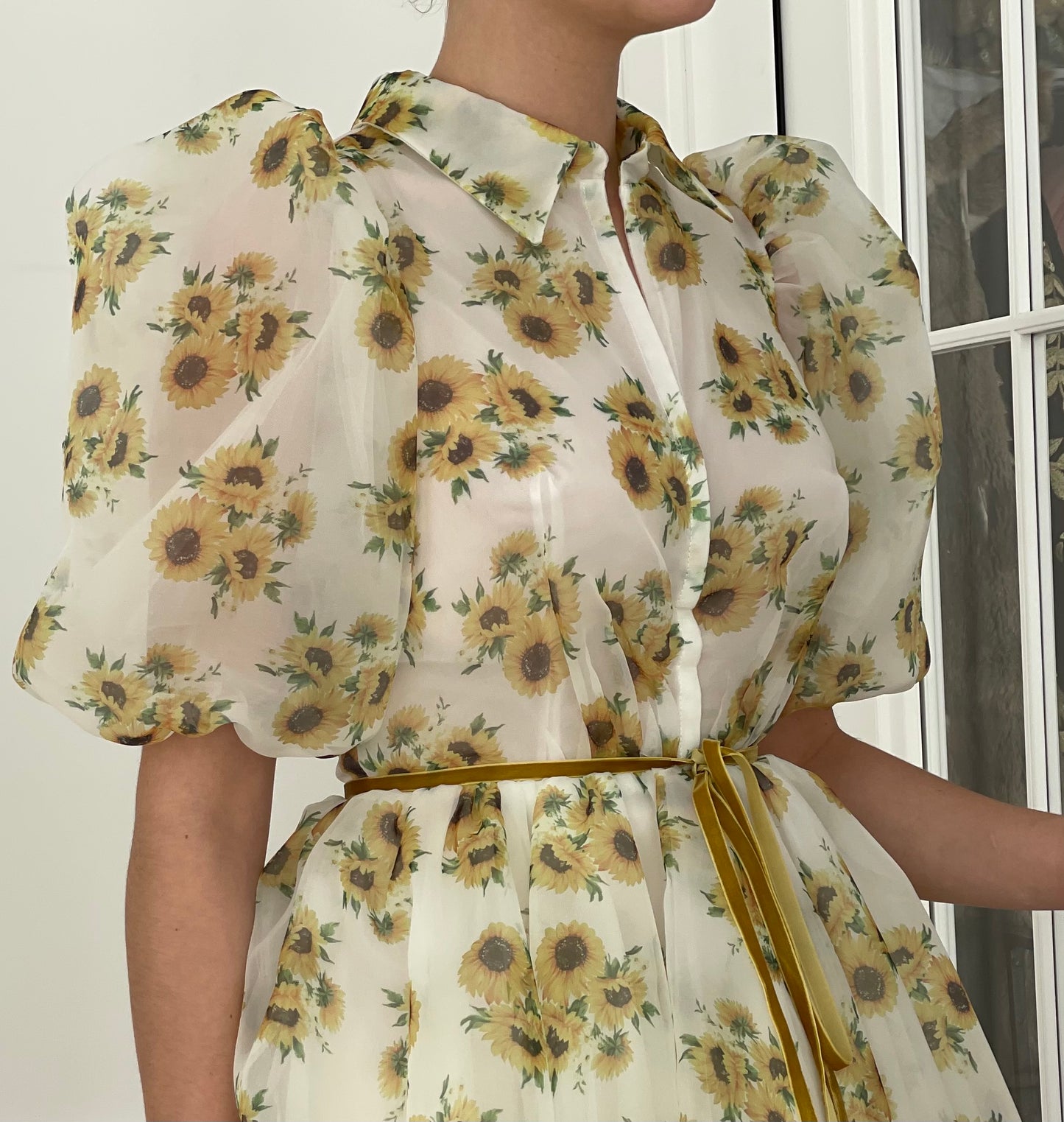 White mini dress with short sleeves and printed flowers