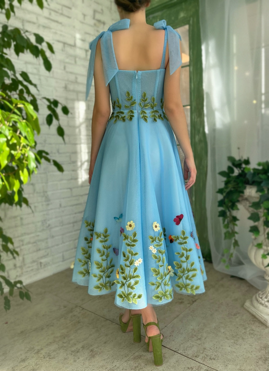 Blue midi dress with bow straps and embroidery
