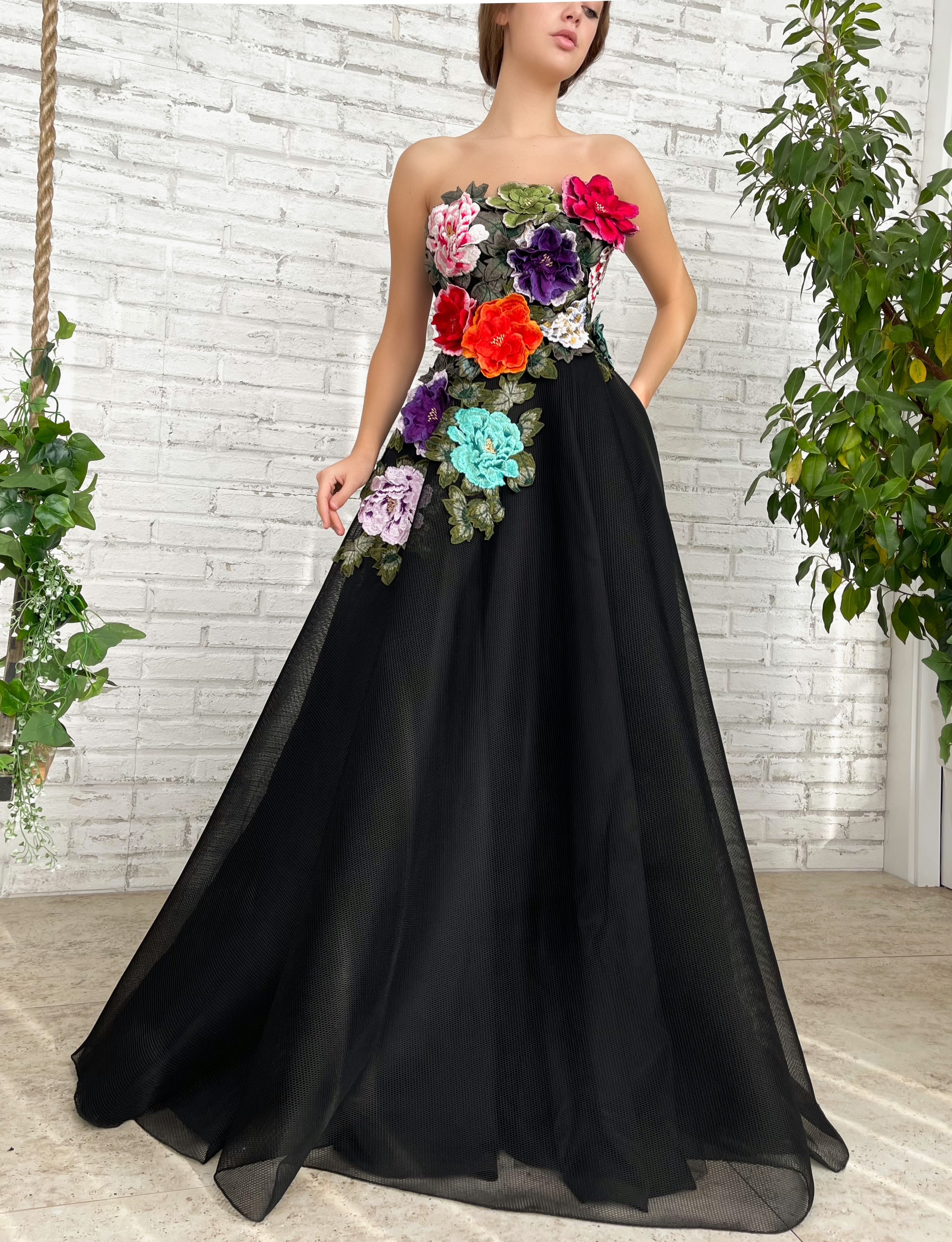 Black A-Line dress with no sleeves and embroidered flowers