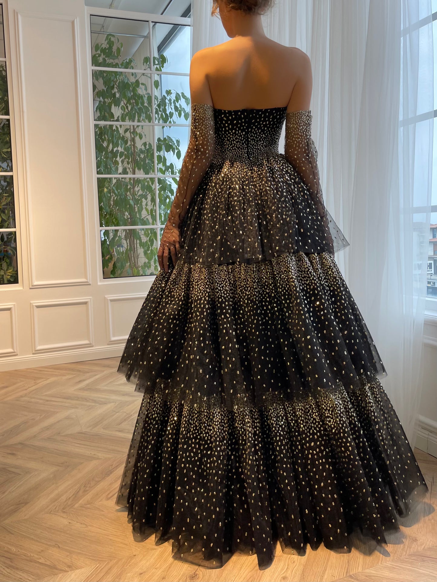 Black A-Line dress with no sleeves and gloves