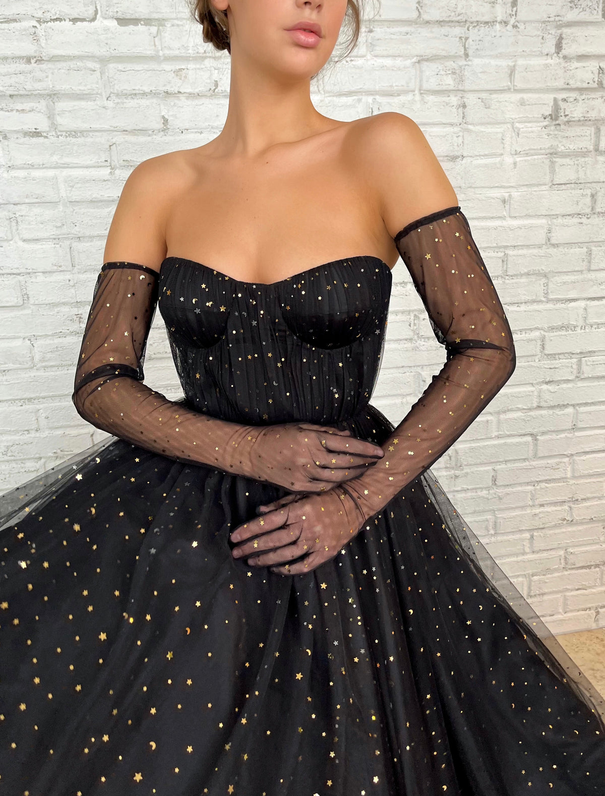 Black A-Line dress with cape sleeves, gloves and starry fabric