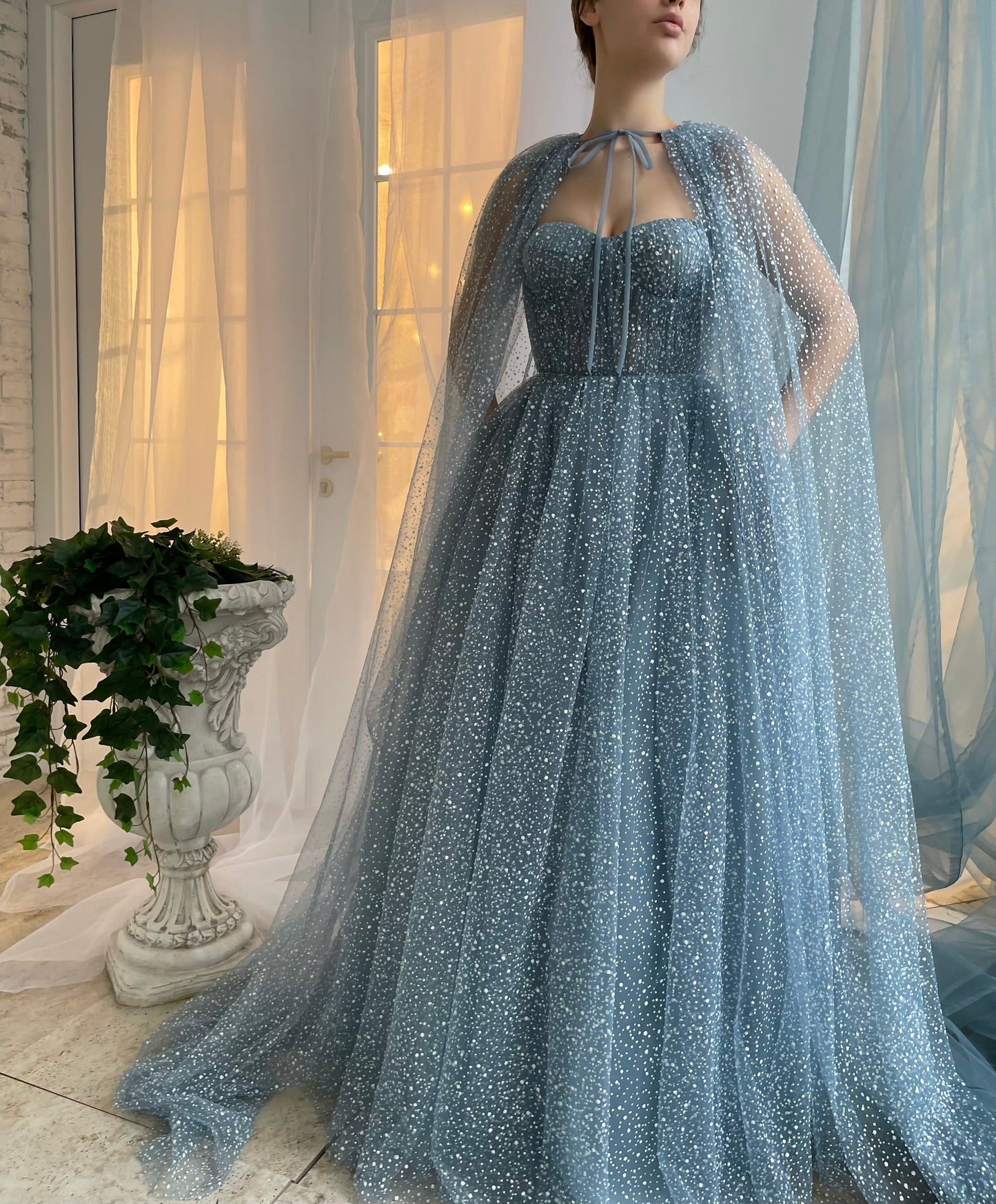 Blue A-Line dress with no sleeves and cape