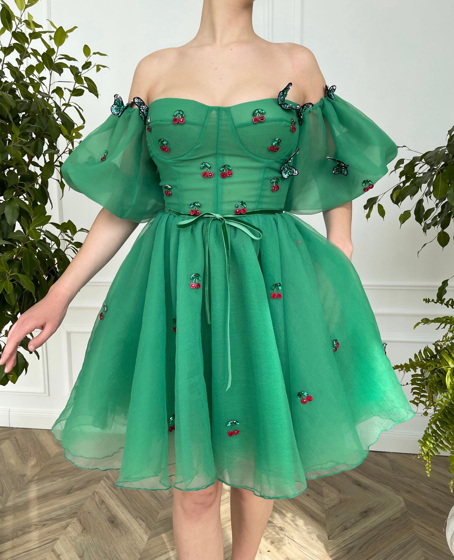 Green mini dress with embroidered cherries, butterflies and off the shoulder sleeves 