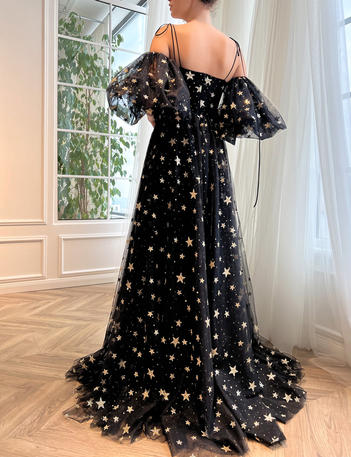 Black A-Line dress with spaghetti straps, off the shoulder sleeves and starry fabric