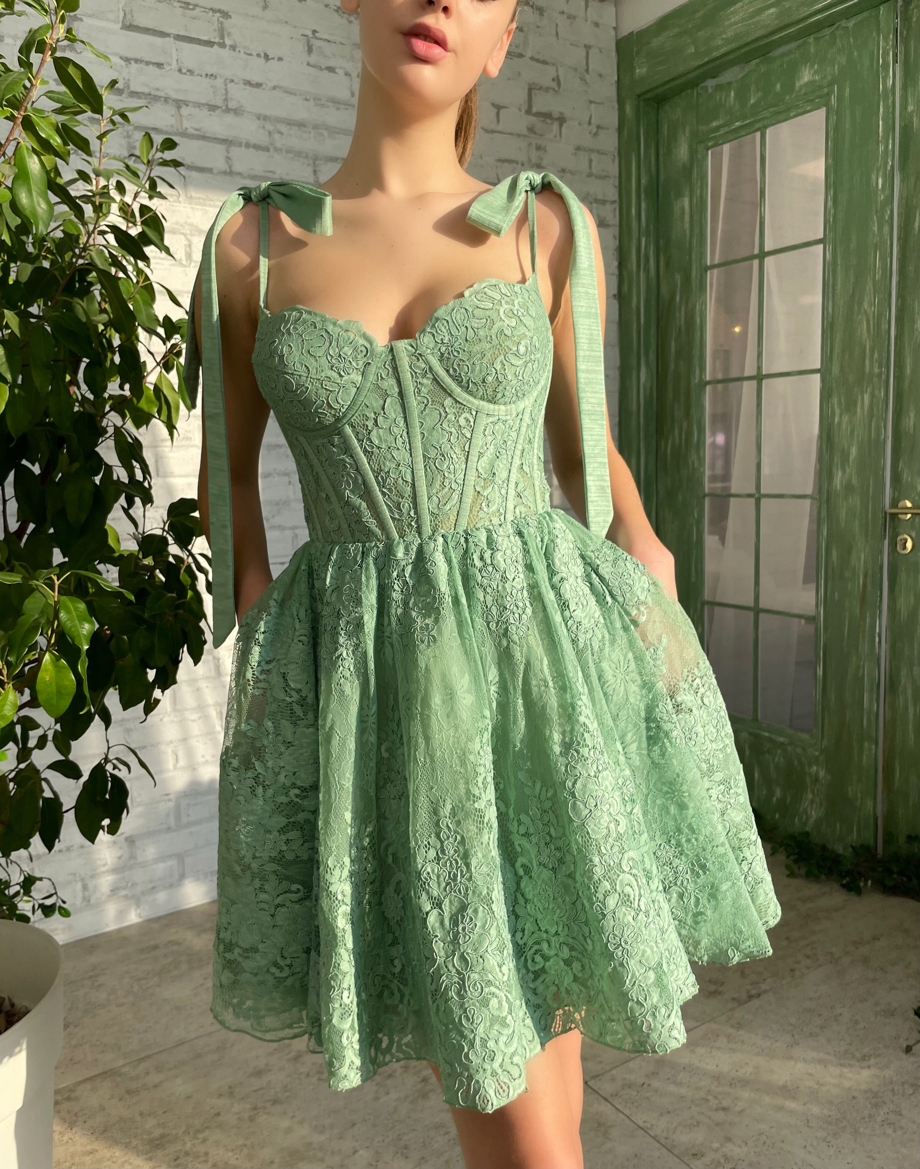Green mini dress with bow straps