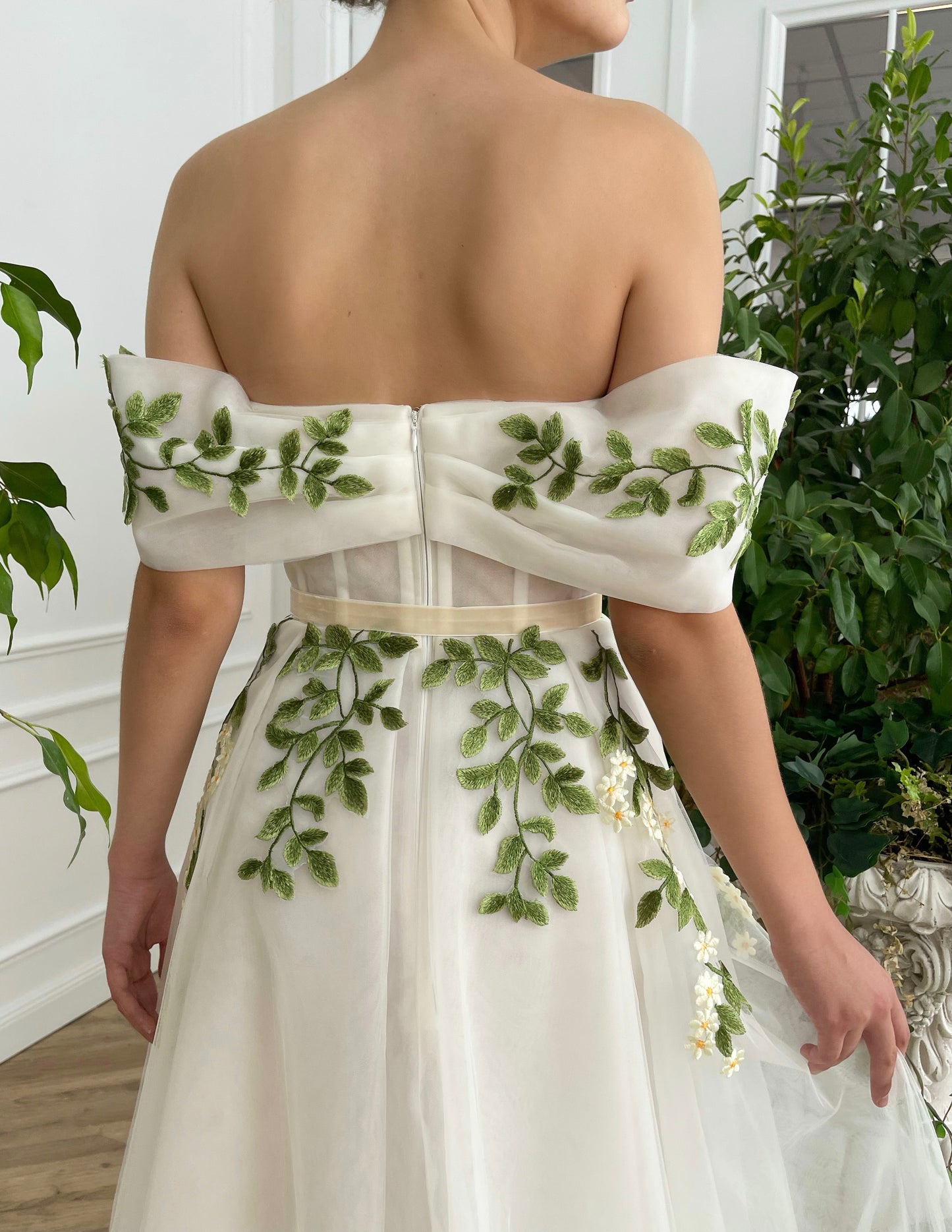 Midi white bridal dress with off the shoulder sleeves and embroidered vines and flowers