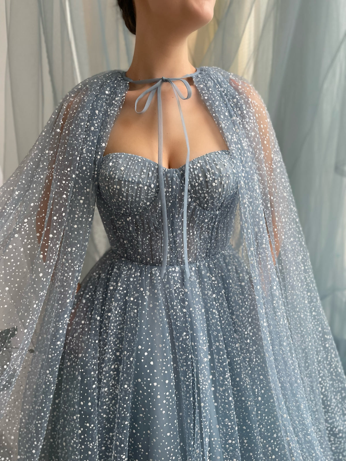 Blue A-Line dress with no sleeves and cape