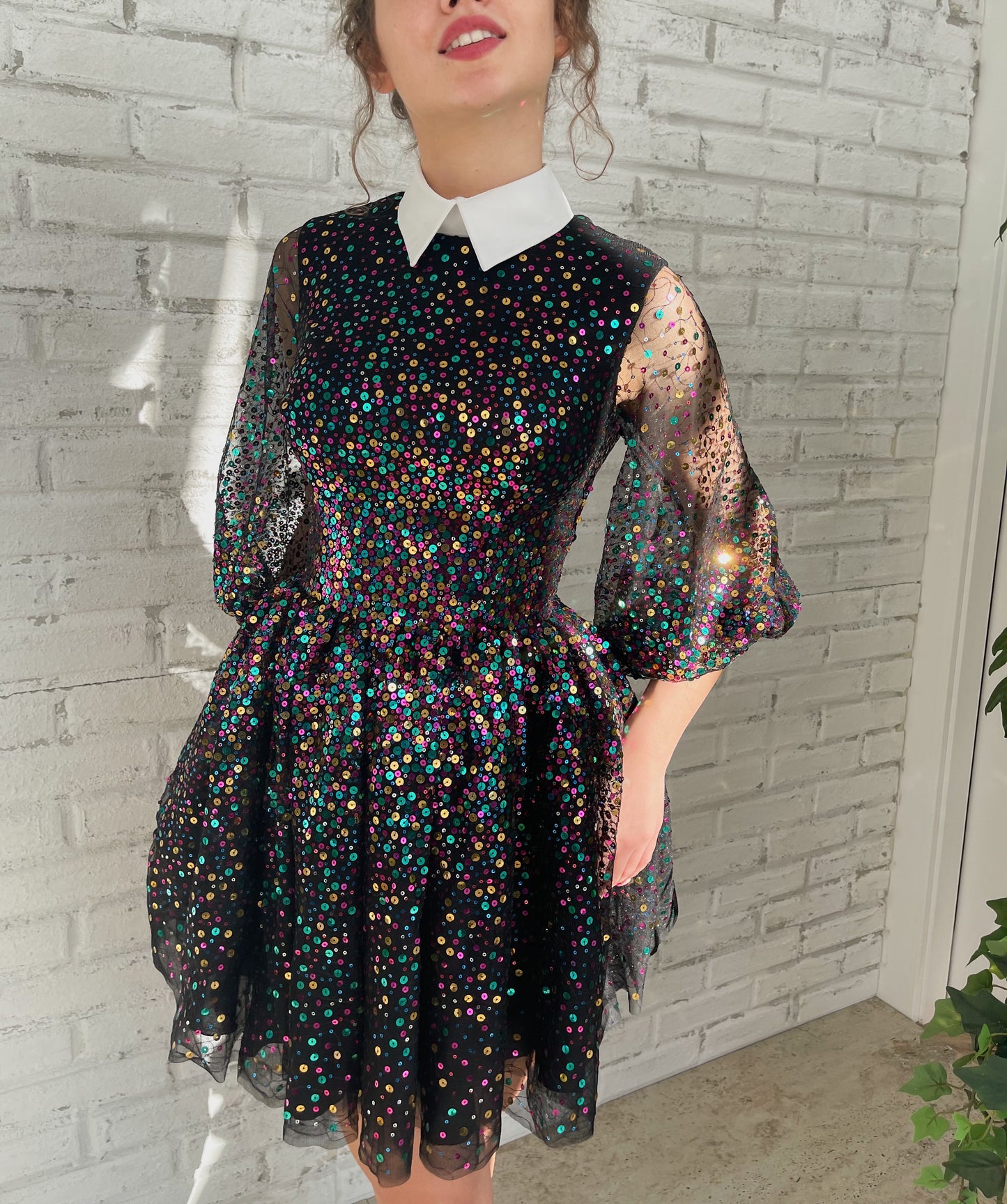 Black mini dress with sequins and short sleeves