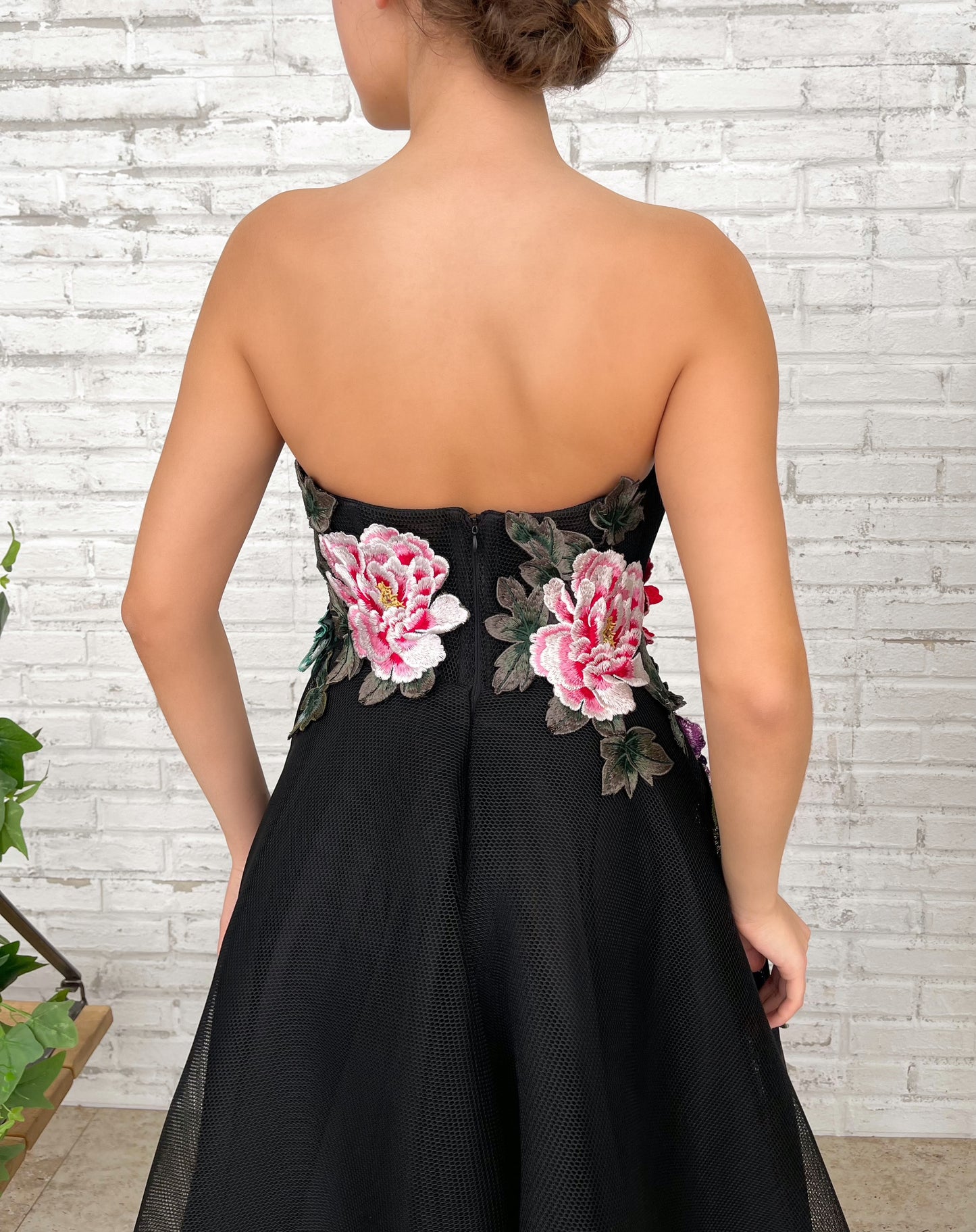 Black A-Line dress with no sleeves and embroidered flowers