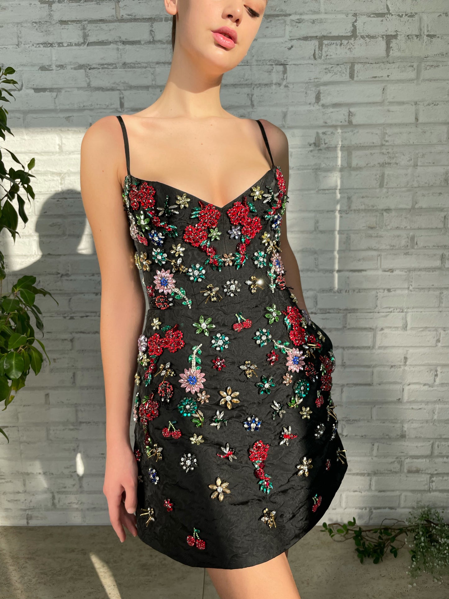 Black mini dress with spaghetti straps and embroidery