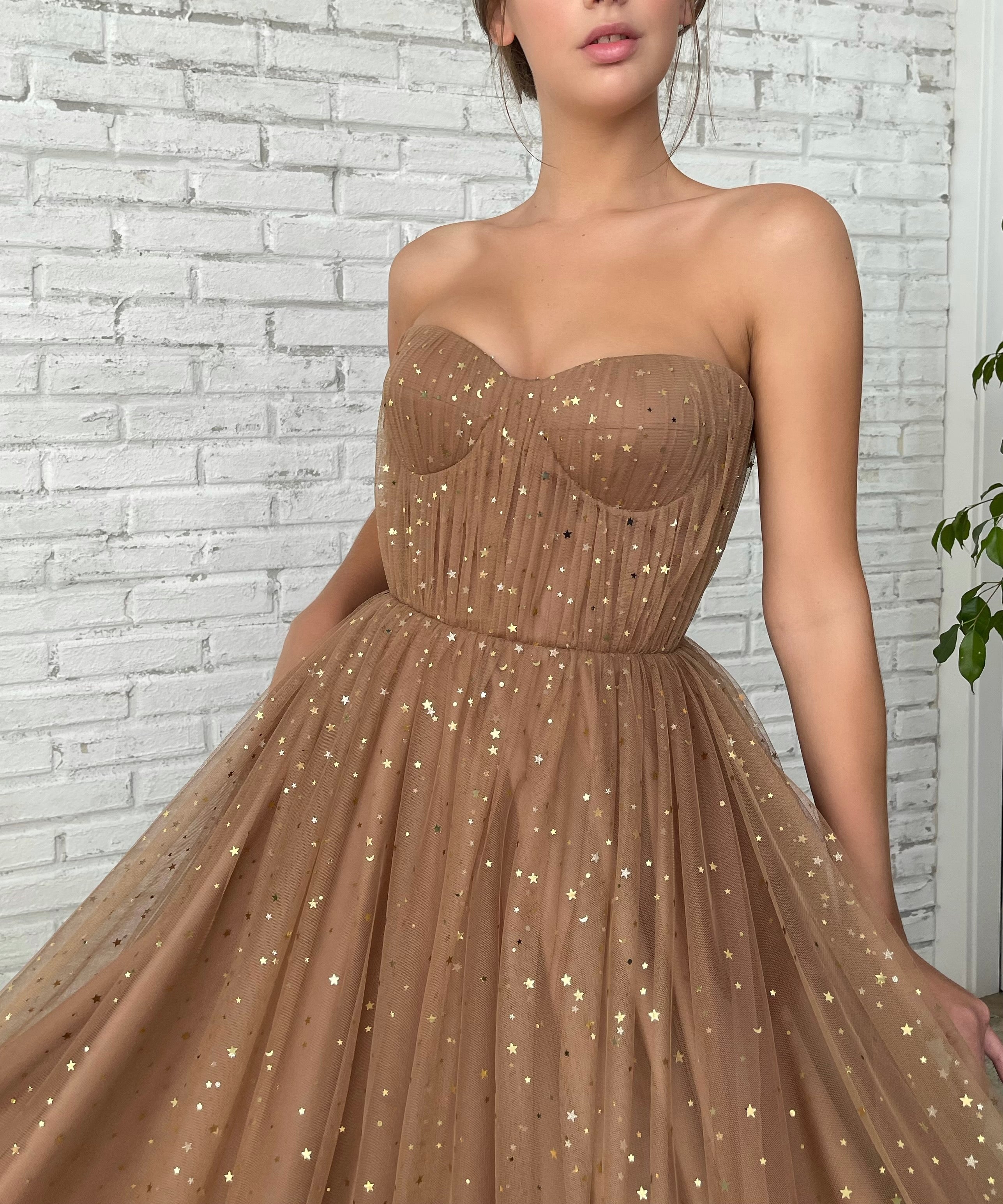 Brown A-Line dress with no sleeves and starry fabric