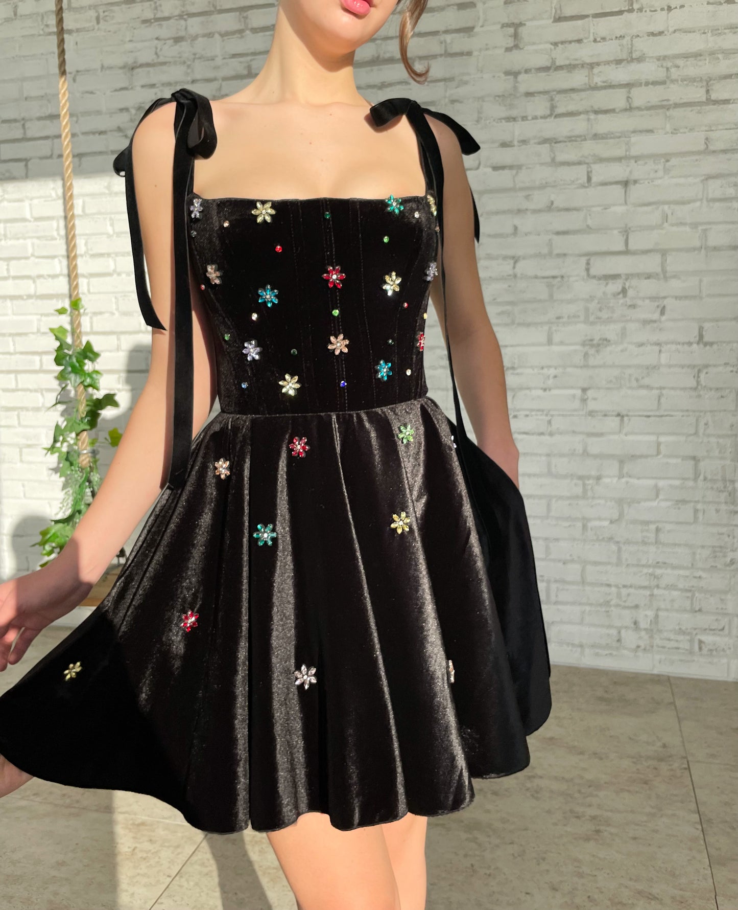 Black mini dress with bow straps and embroidery