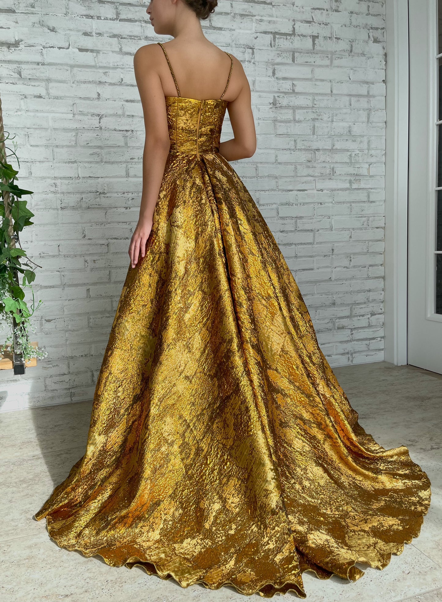 Gold A-Line dress with spaghetti straps and beading