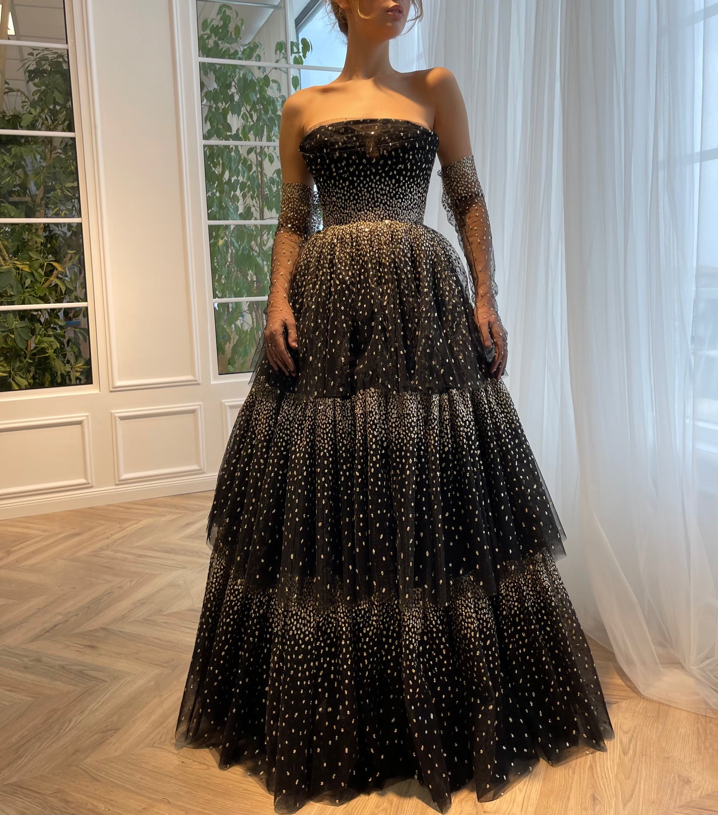 Black A-Line dress with no sleeves and gloves