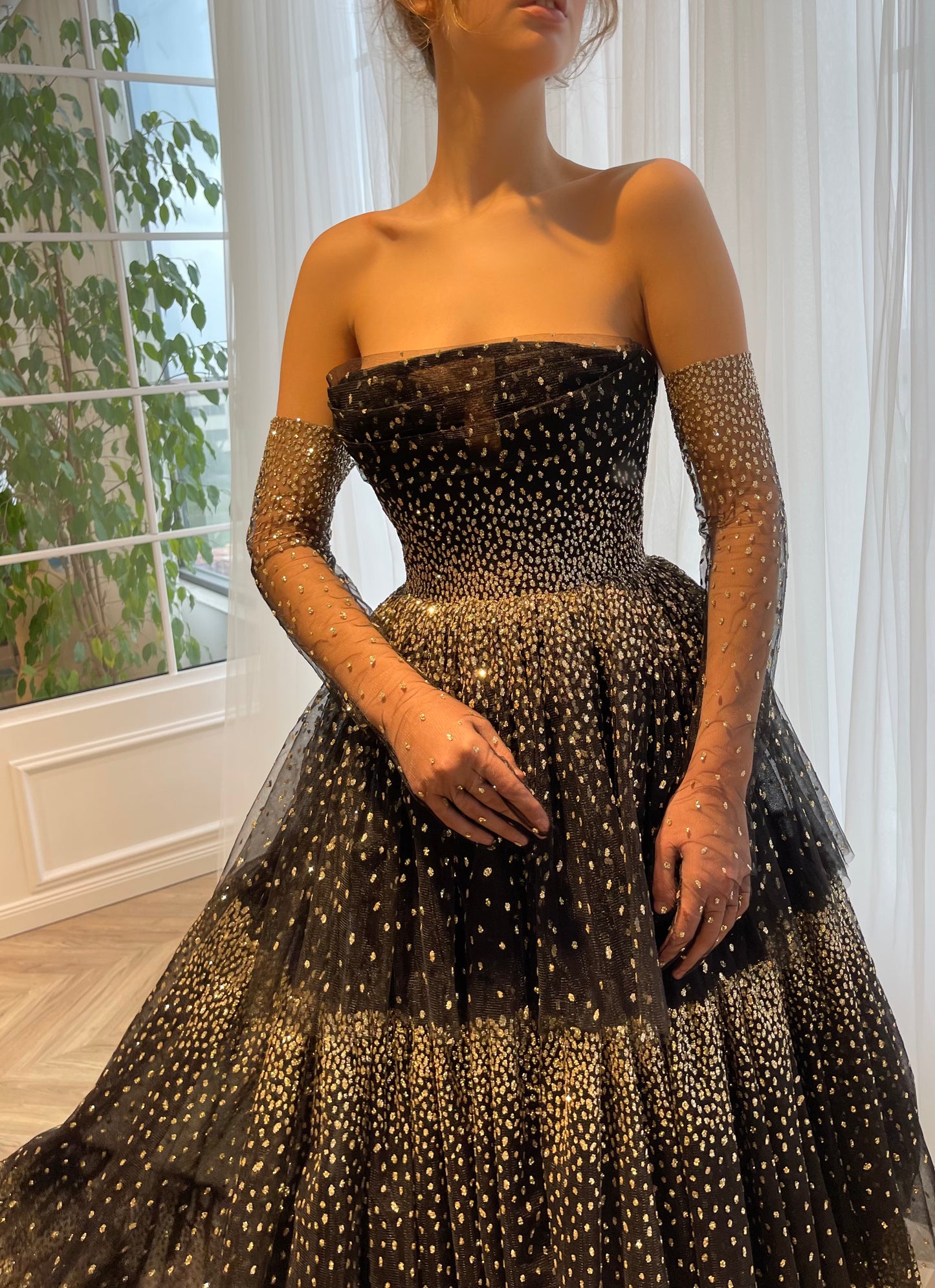 Black A-Line dress with no sleeves and gloves