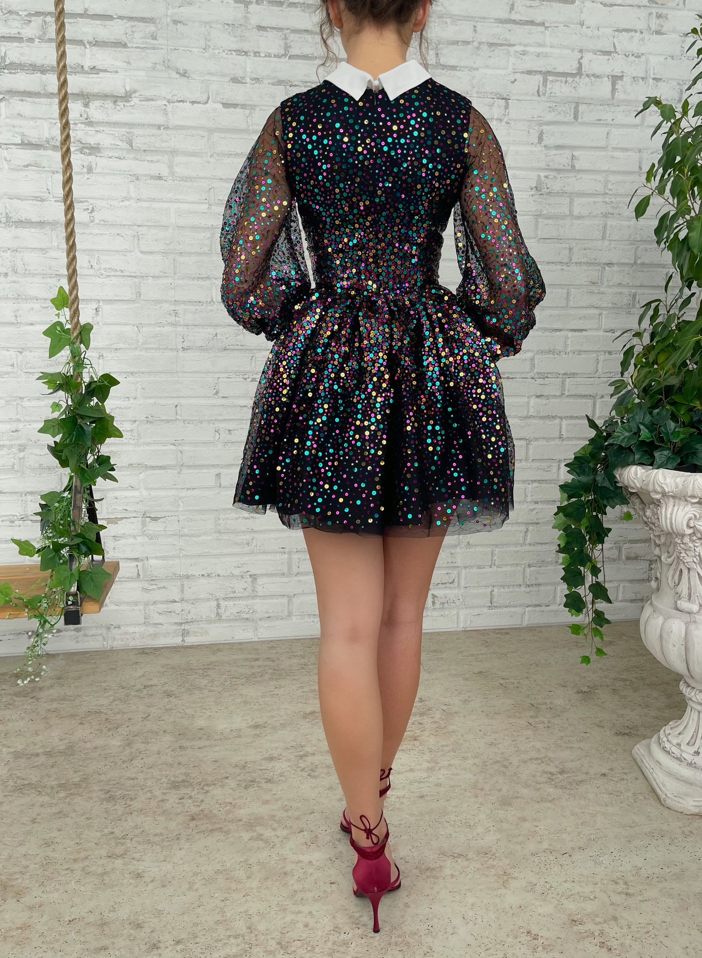 Black mini dress with sequins and short sleeves