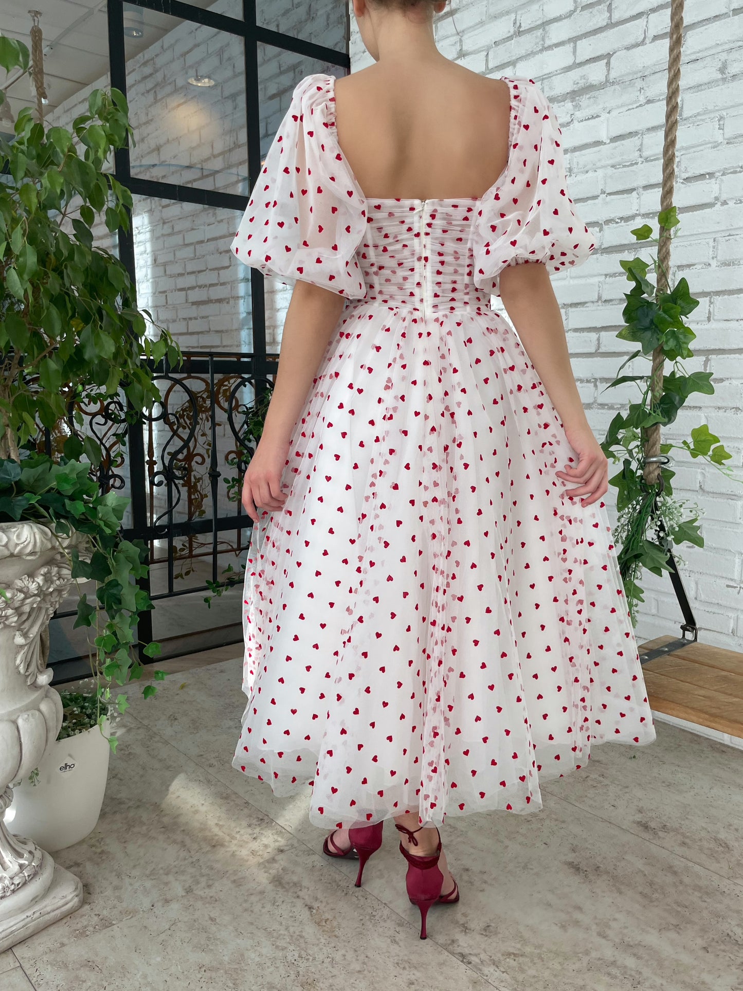 White midi dress with short puff sleeves and hearty fabric