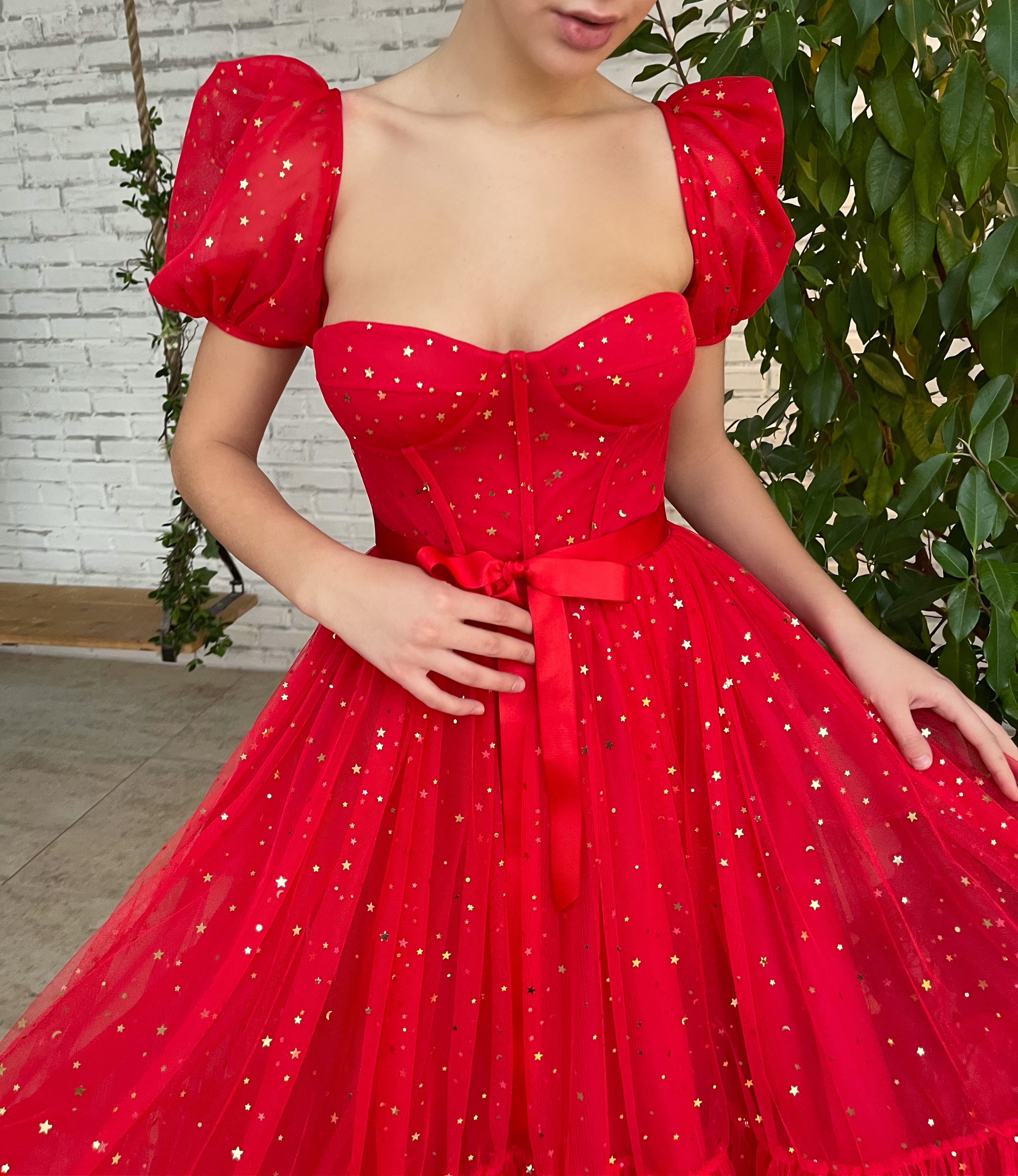 Red midi dress with short sleeves and starry fabric