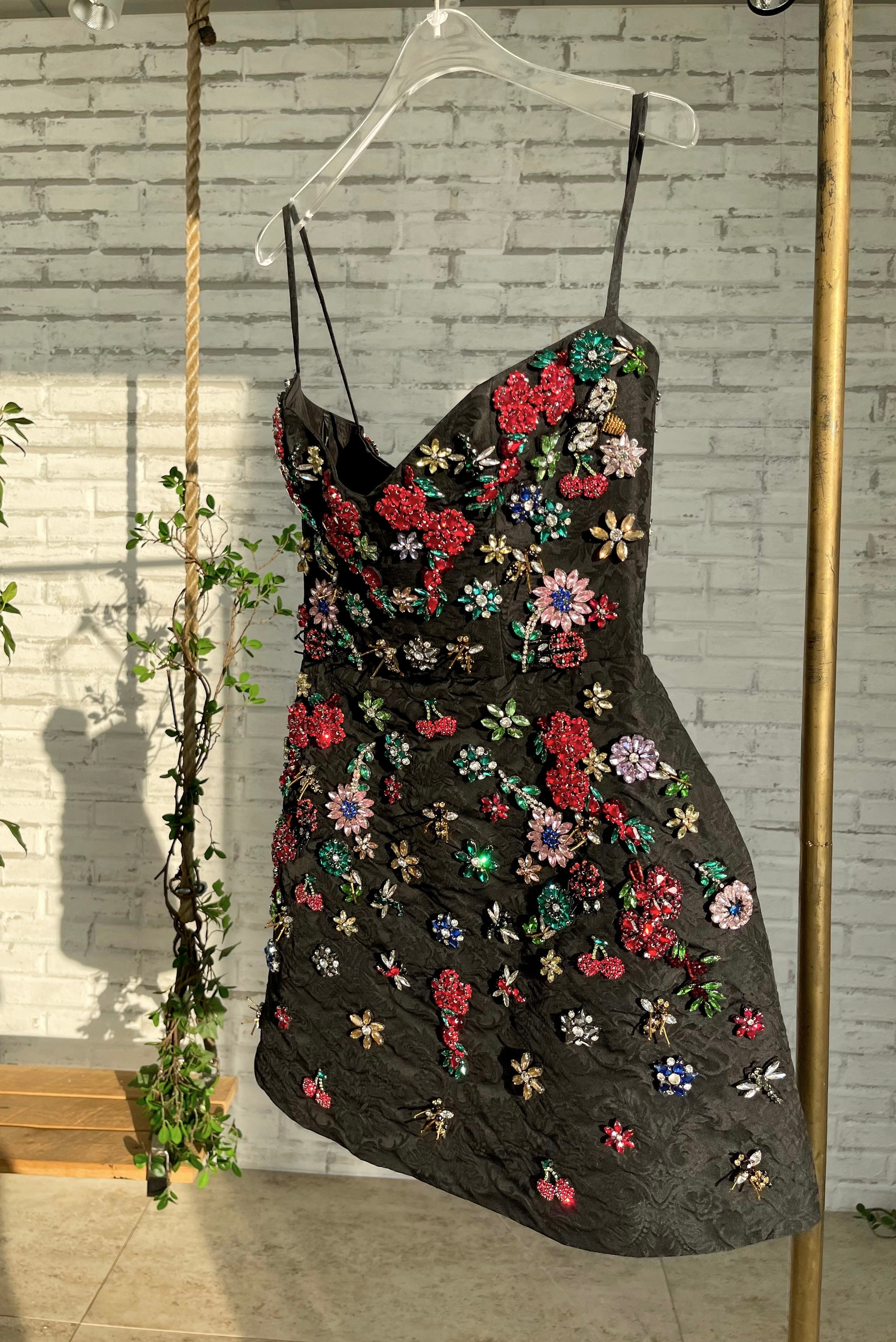 Black mini dress with spaghetti straps and embroidery