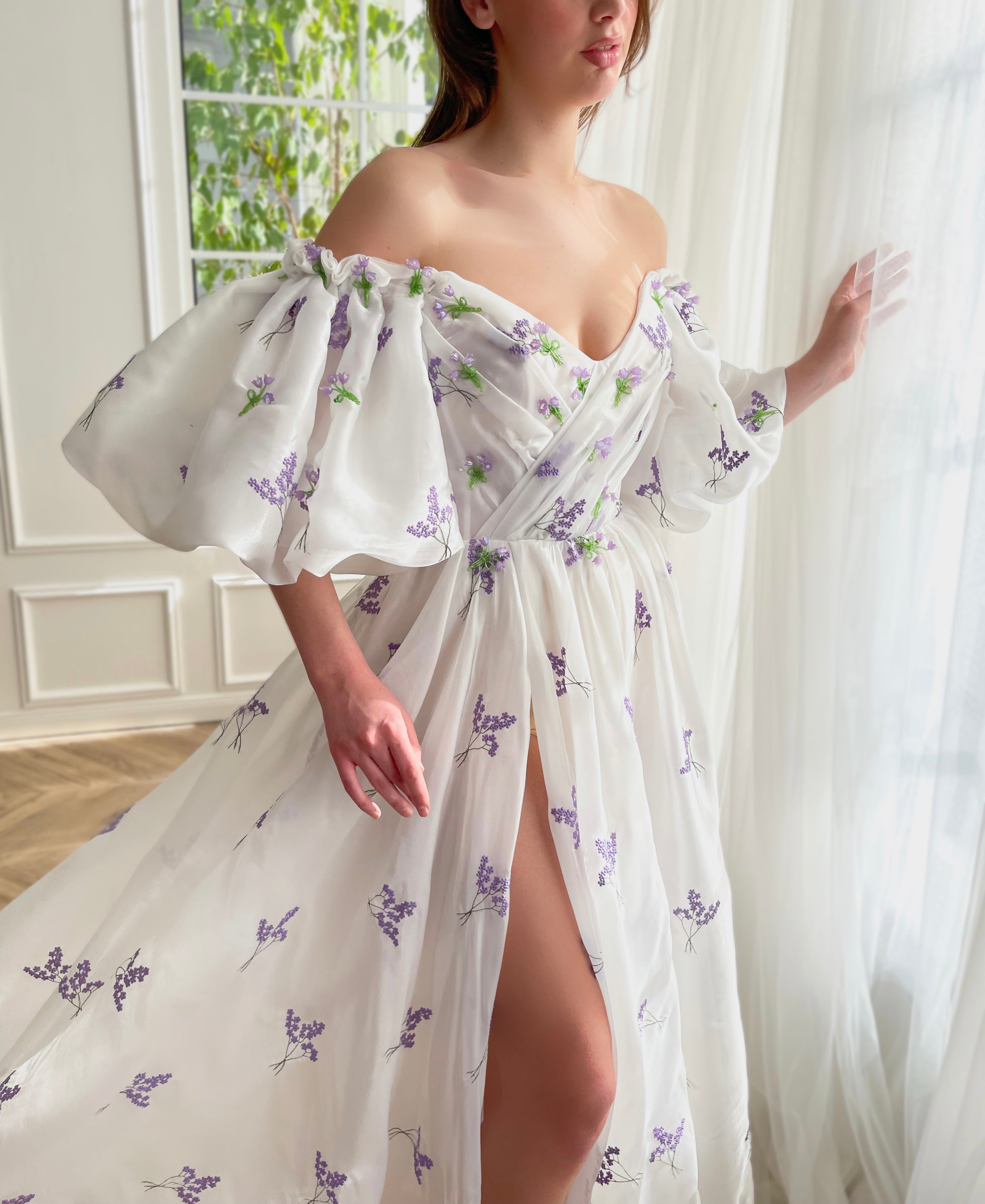 White A-Line dress with short off the shoulder sleeves and printed flowers
