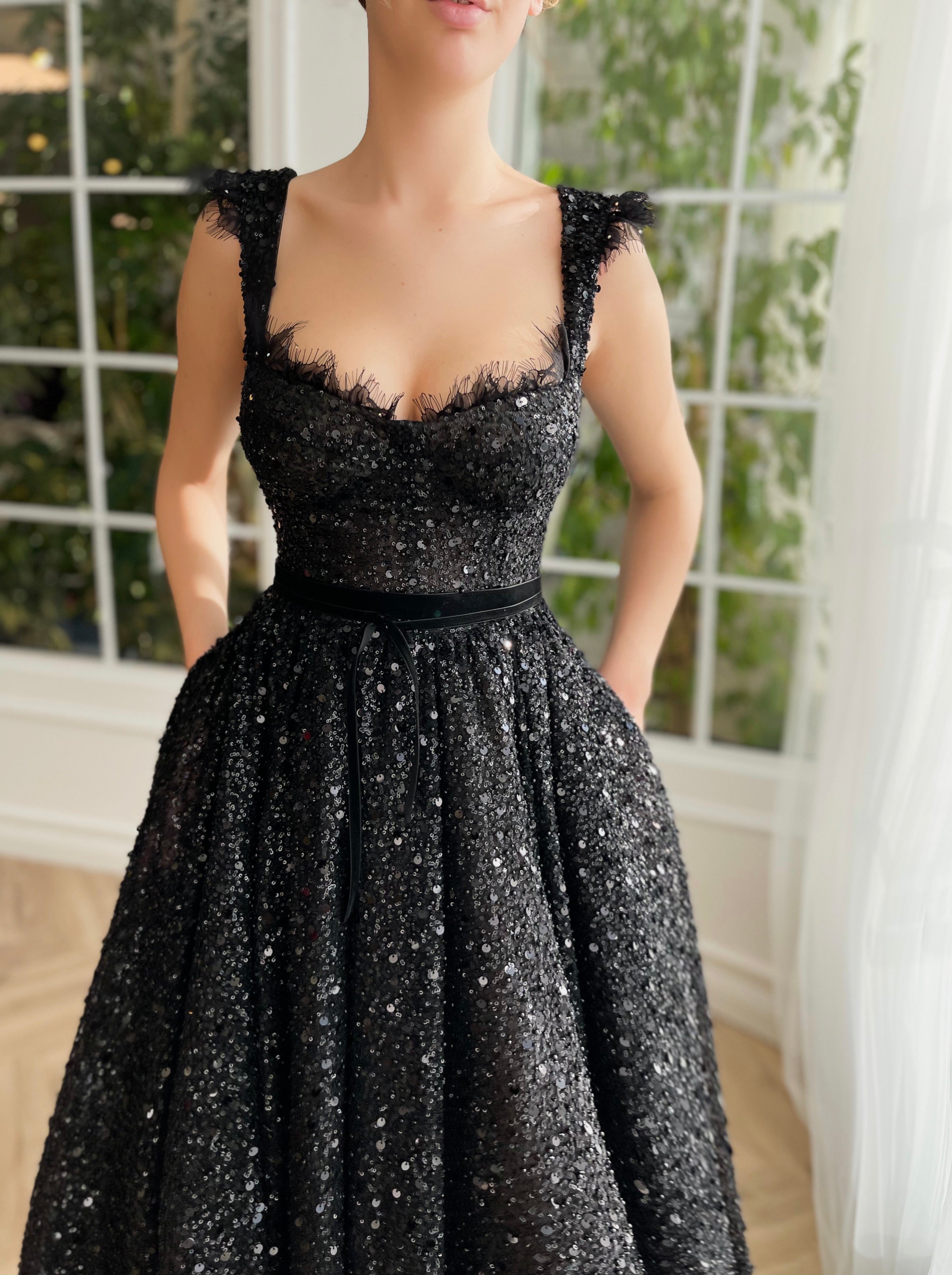 Black midi dress with sequins and straps