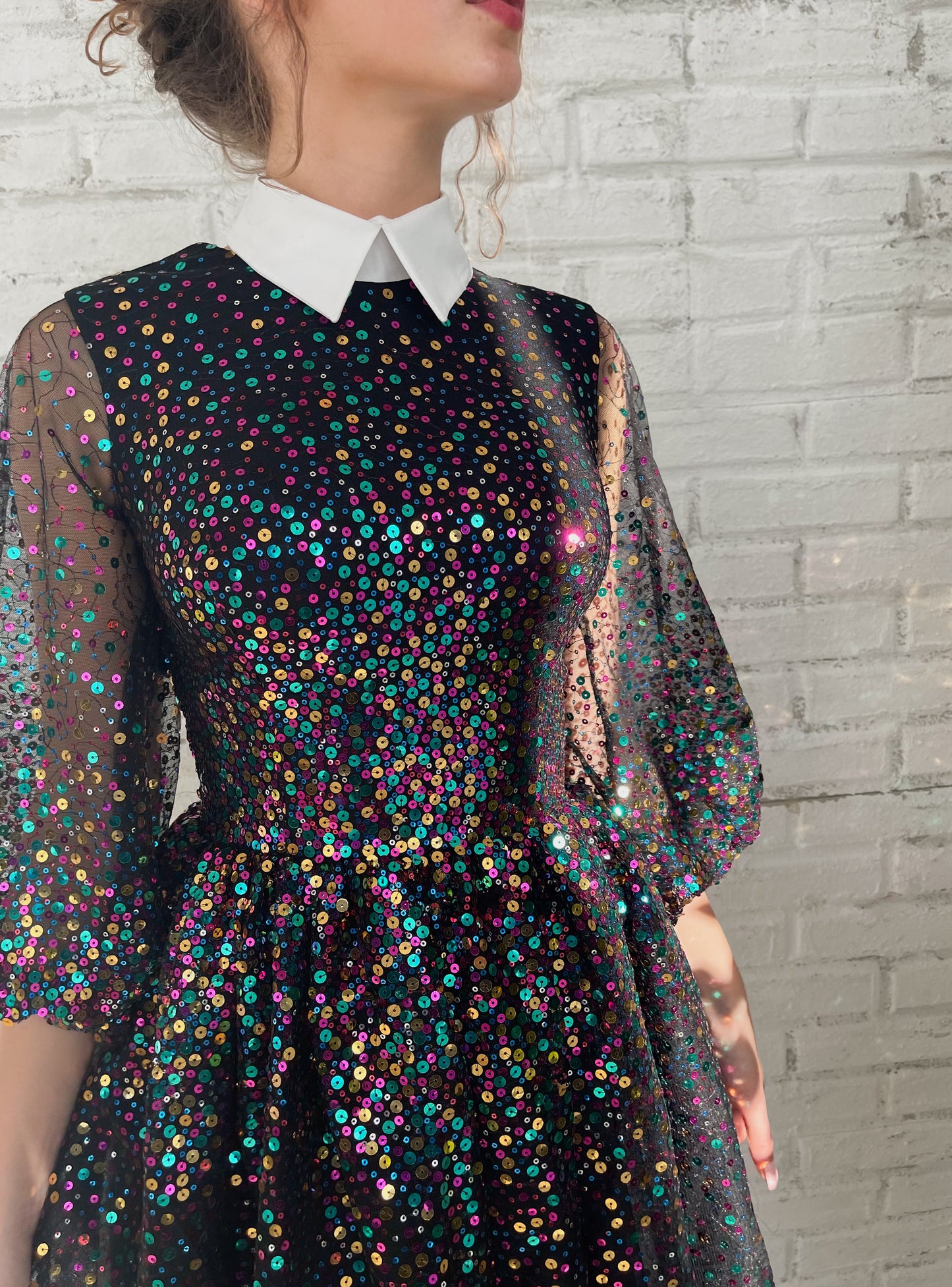 Black mini dress with sequins and short sleeves
