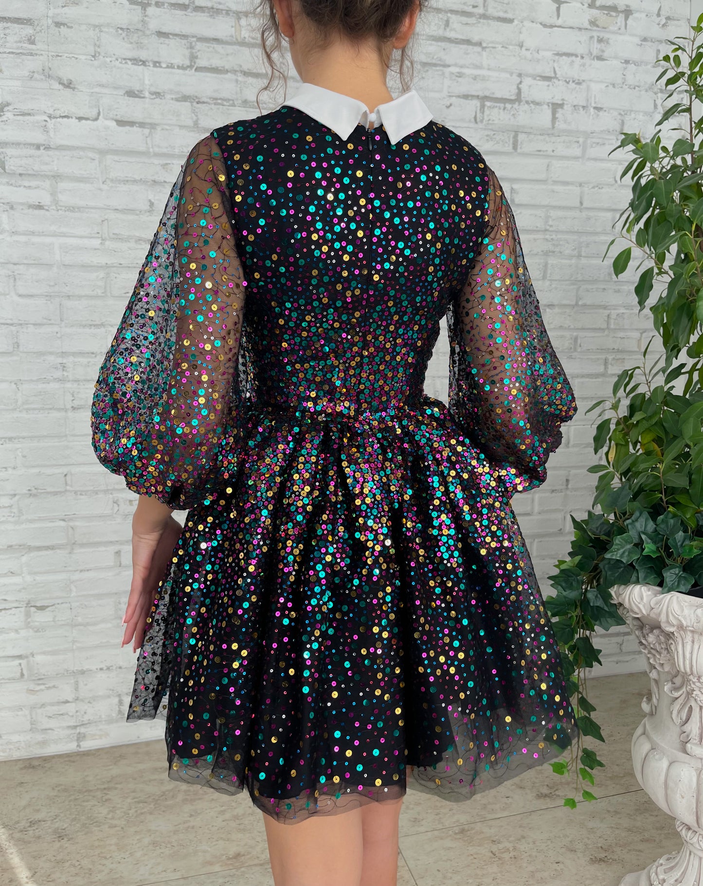 Black mini dress with sequins and short sleeves