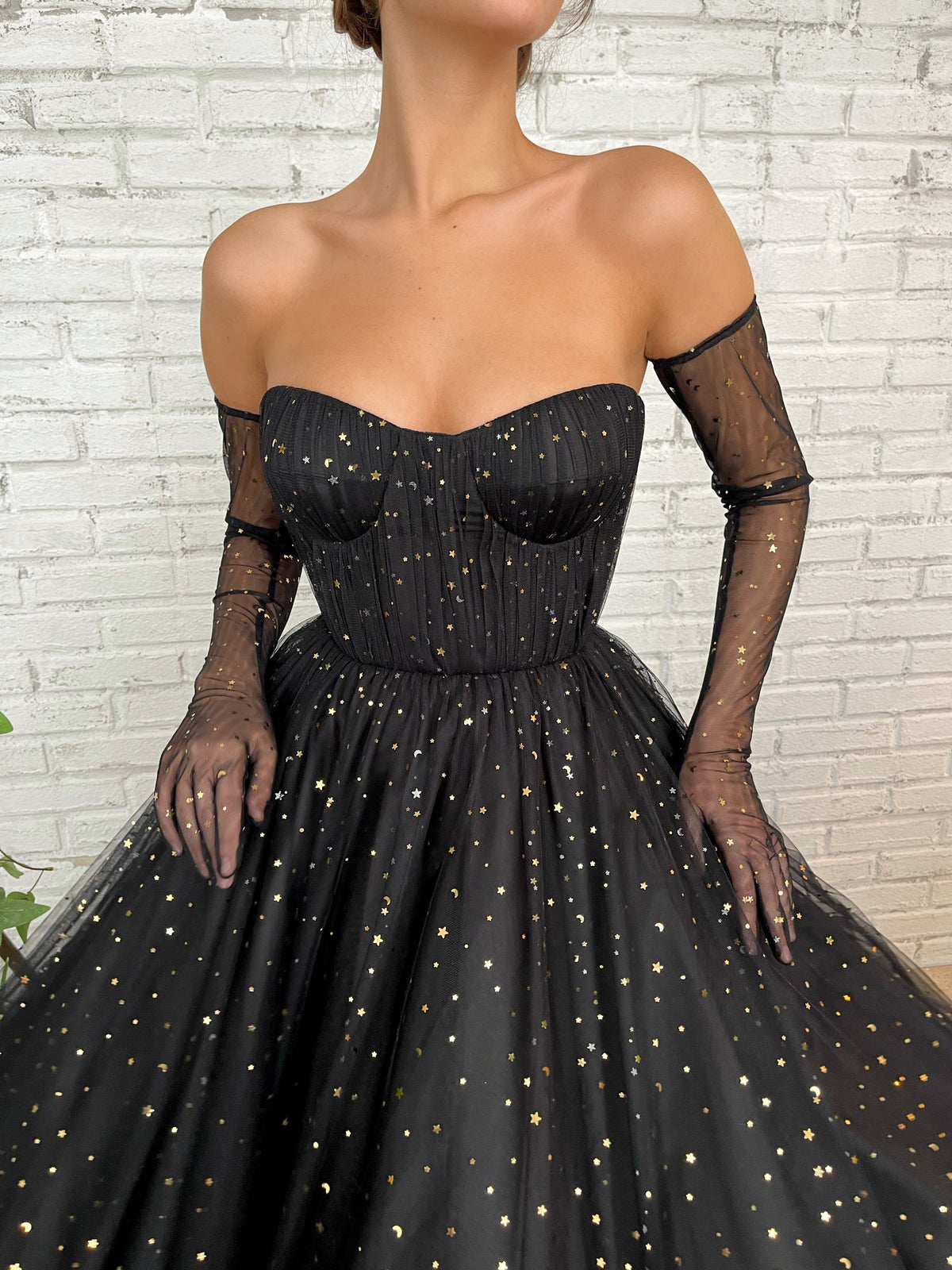 Black A-Line dress with cape sleeves, gloves and starry fabric