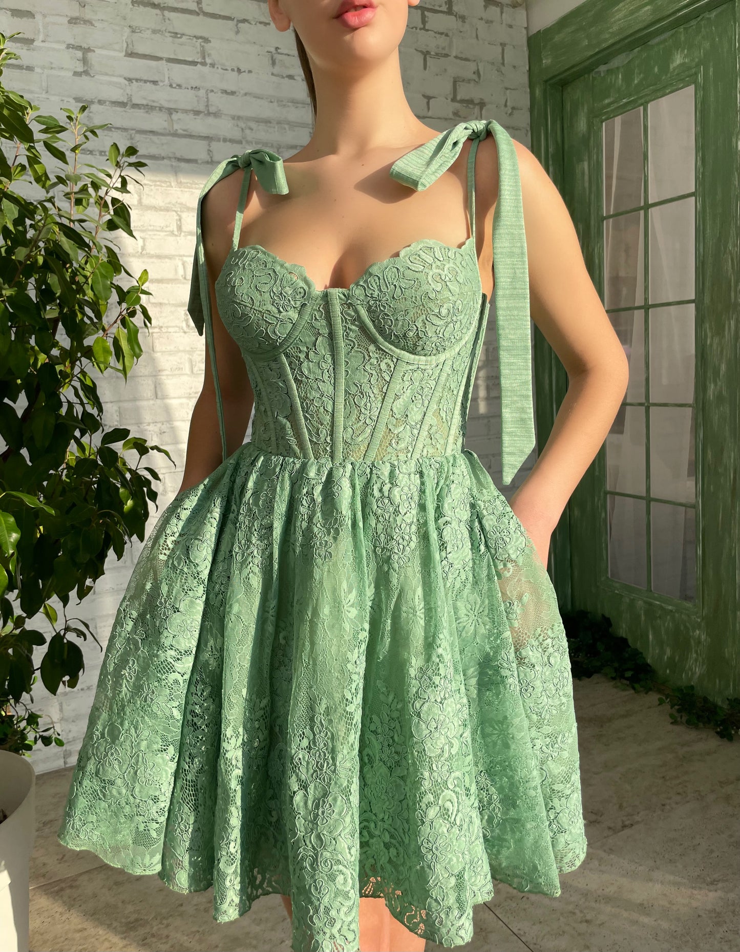 Green mini dress with bow straps