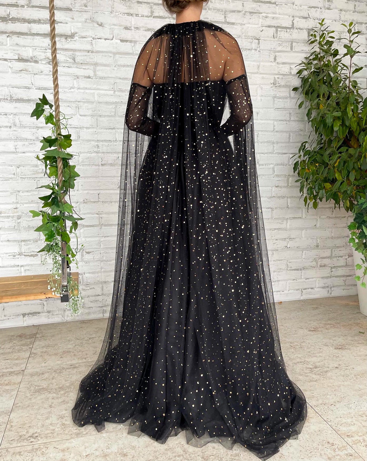Black A-Line dress with cape sleeves, gloves and starry fabric