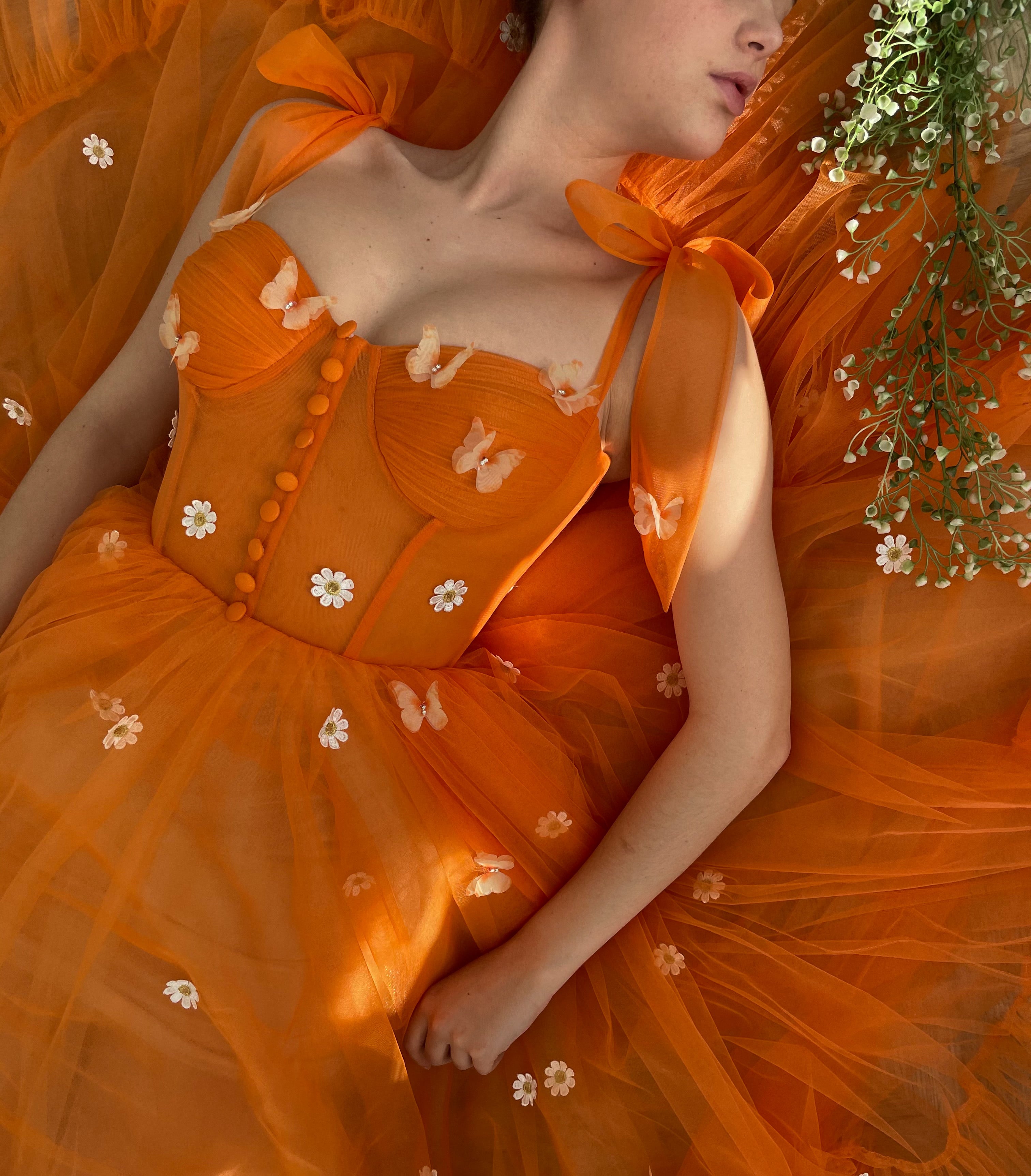 Orange midi dress with bow straps and embroidered daisies and butterflies