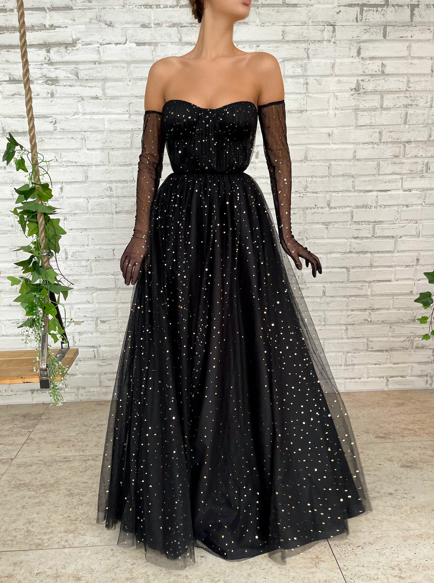 Black A-Line dress with cape sleeves, gloves and starry fabric