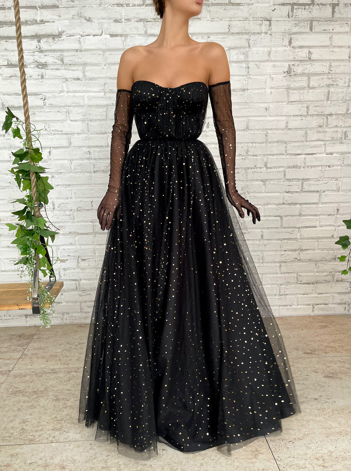 Black A-Line dress with cape sleeves, gloves and starry fabric