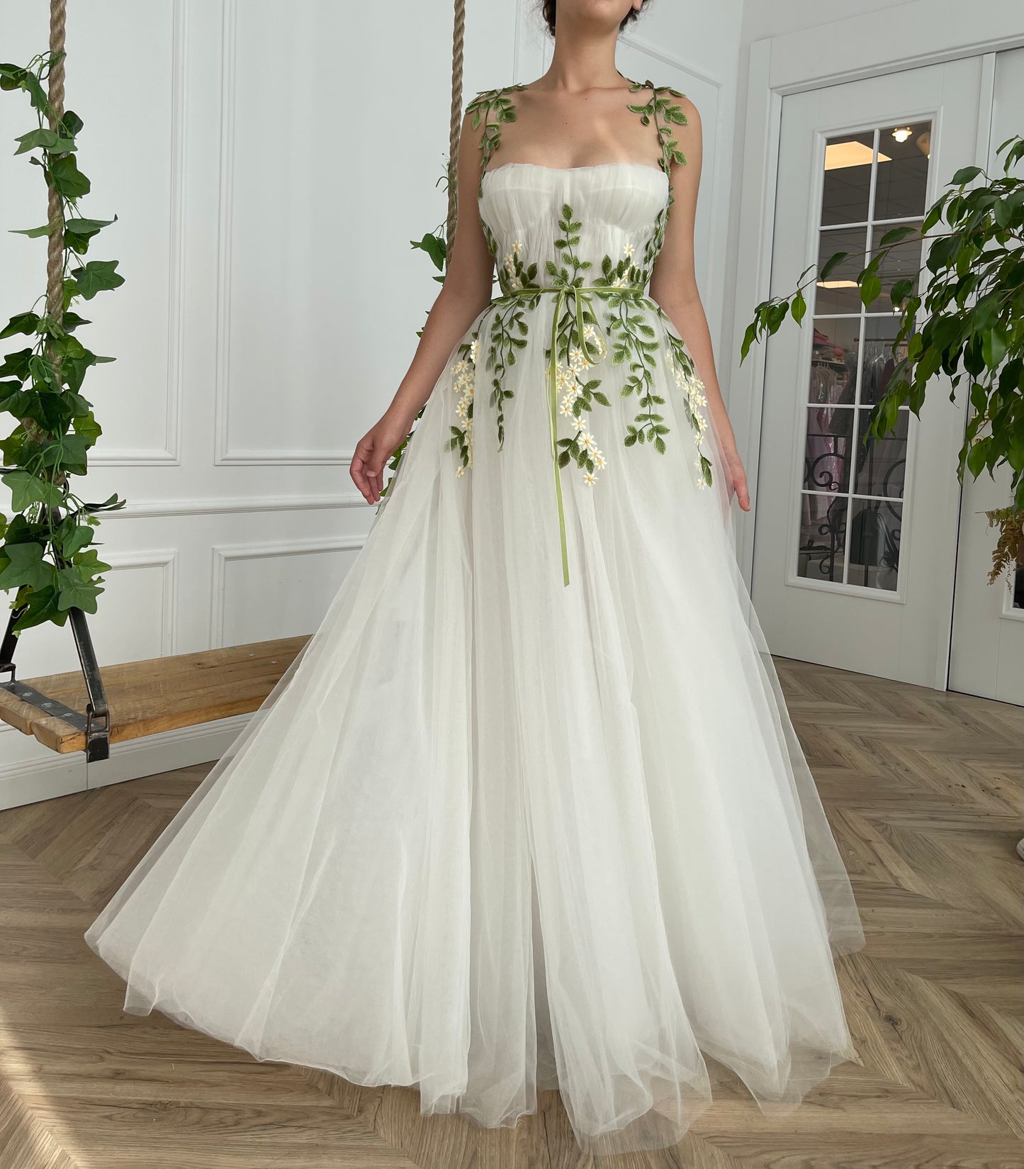 A line white bridal dress with straps and embroidered flowers