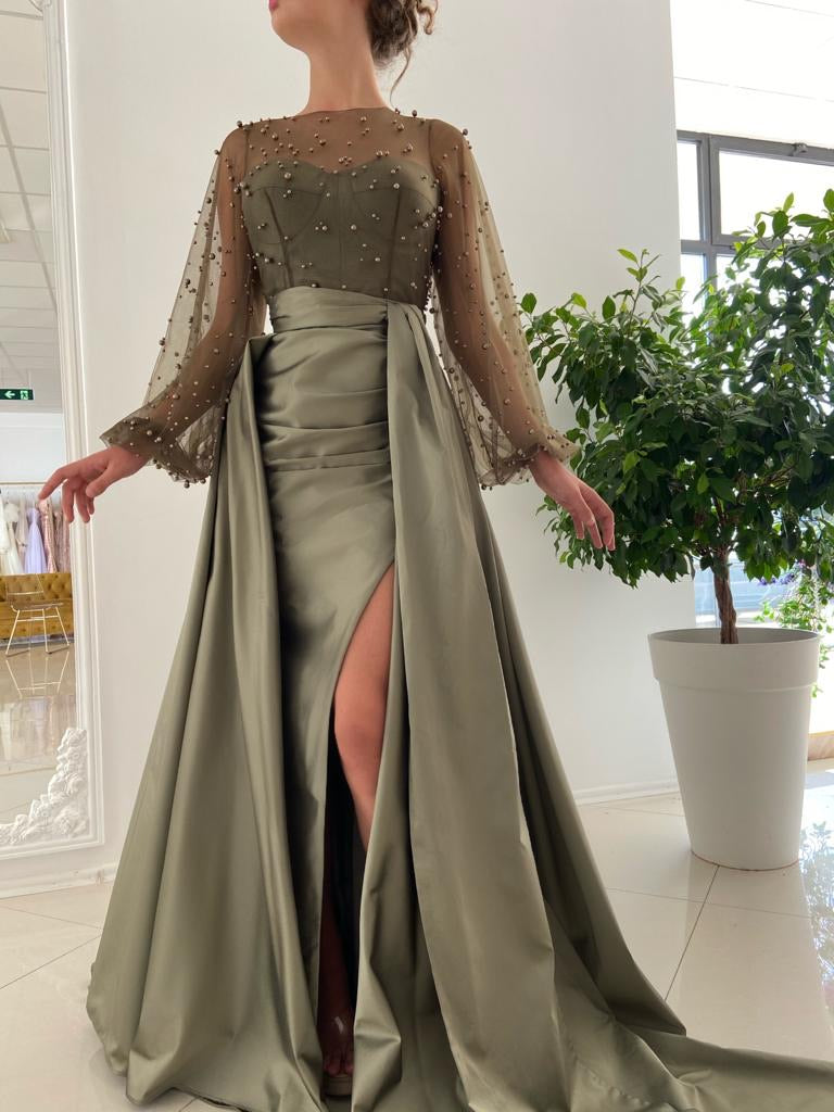 Green overskirt dress with long sleeves and beading