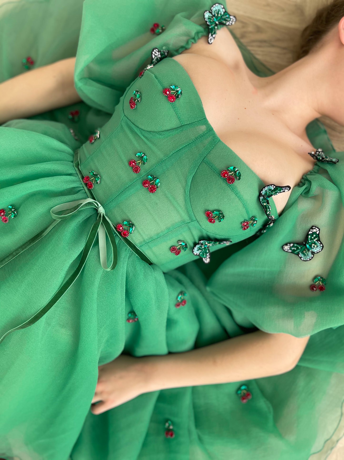Green mini dress with embroidered cherries, butterflies and off the shoulder sleeves 