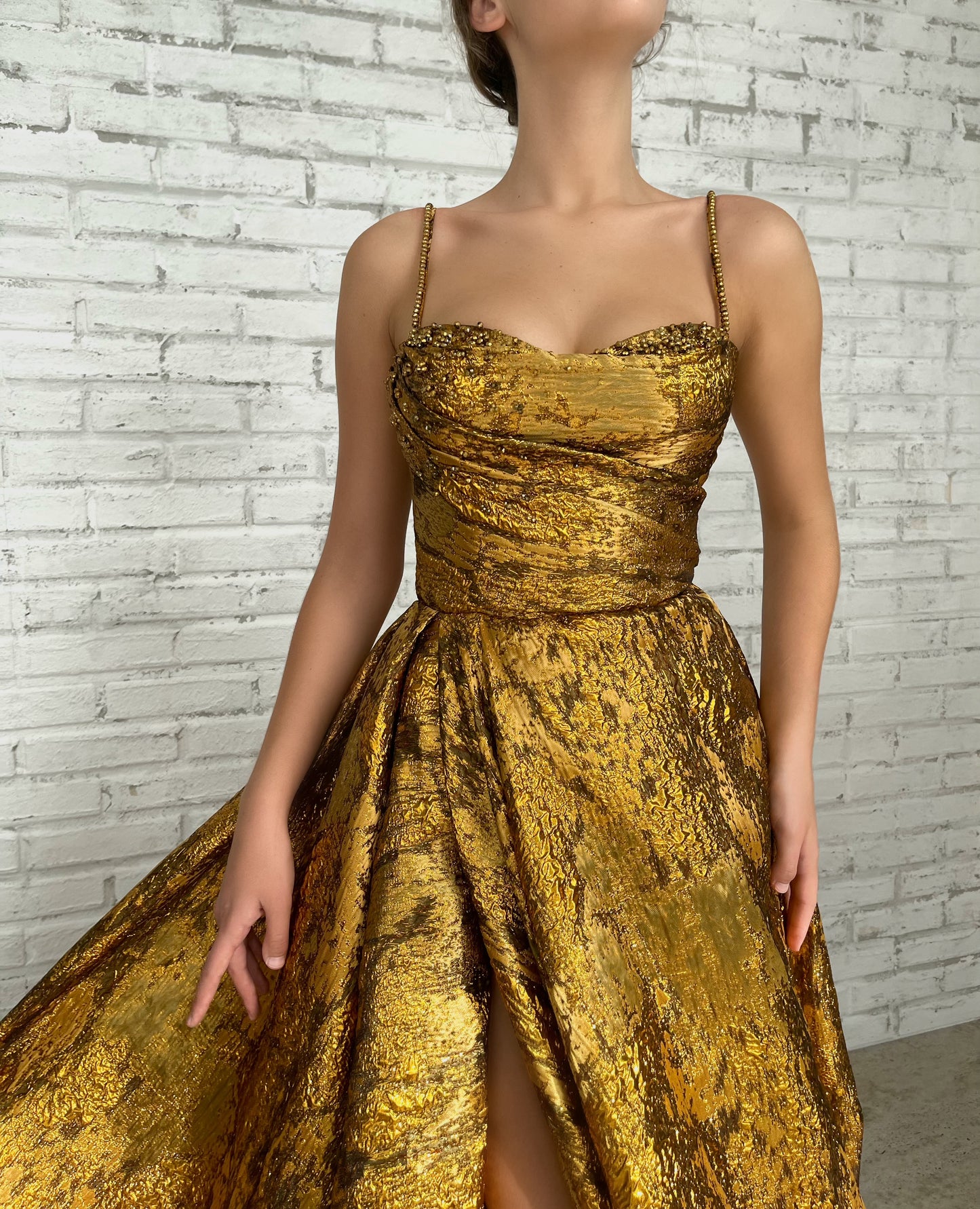 Gold A-Line dress with spaghetti straps and beading