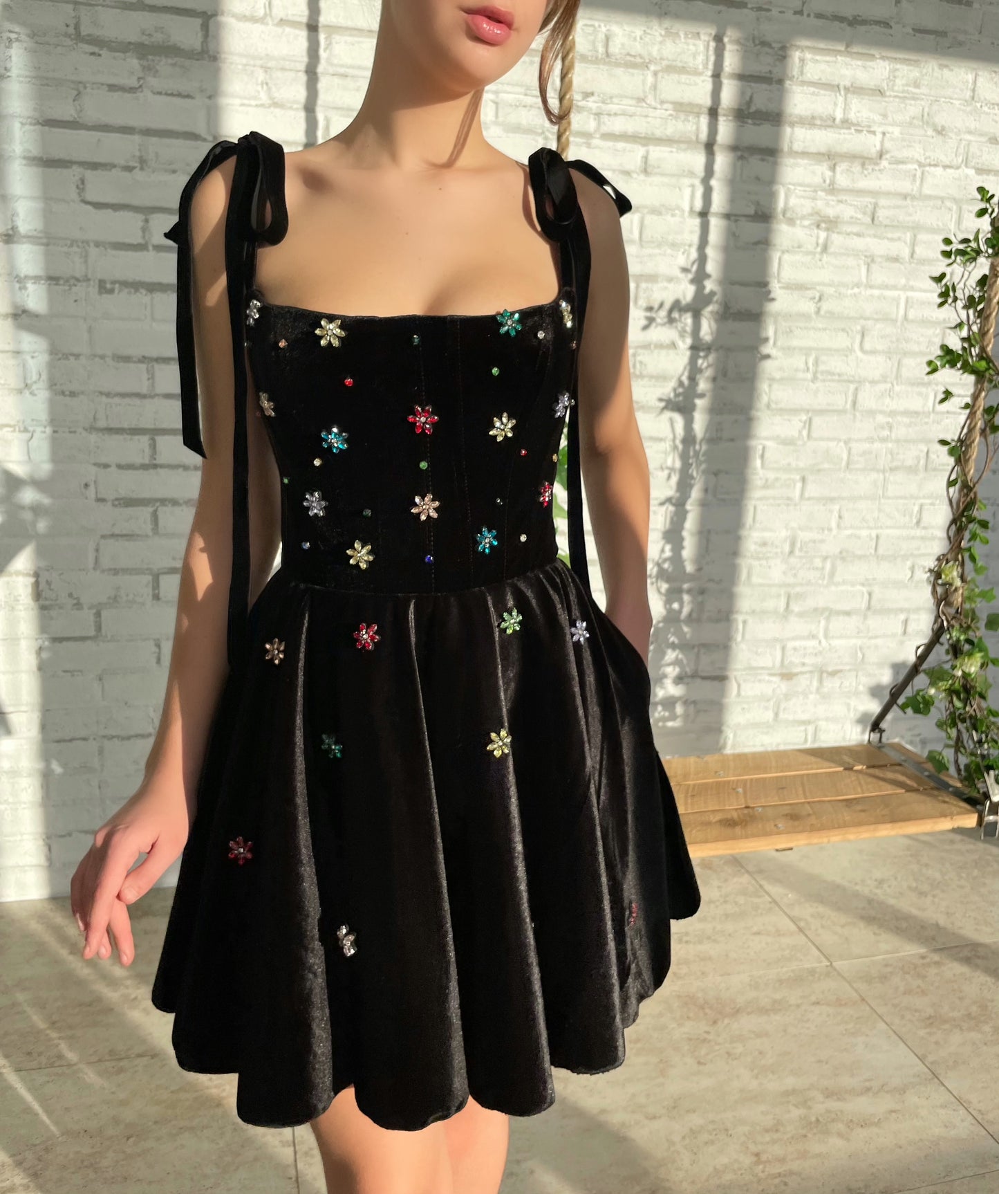 Black mini dress with bow straps and embroidery