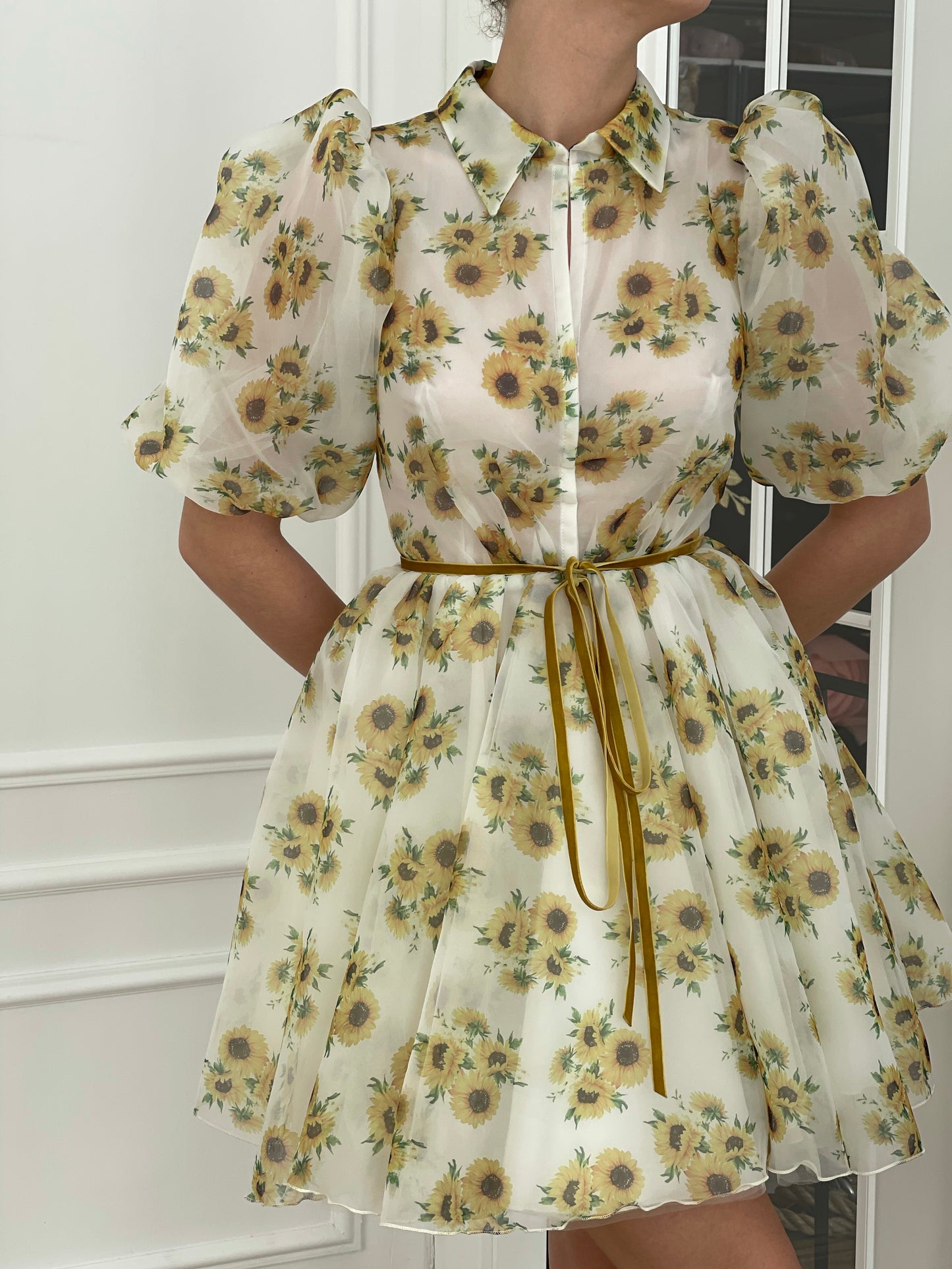 White mini dress with short sleeves and printed flowers