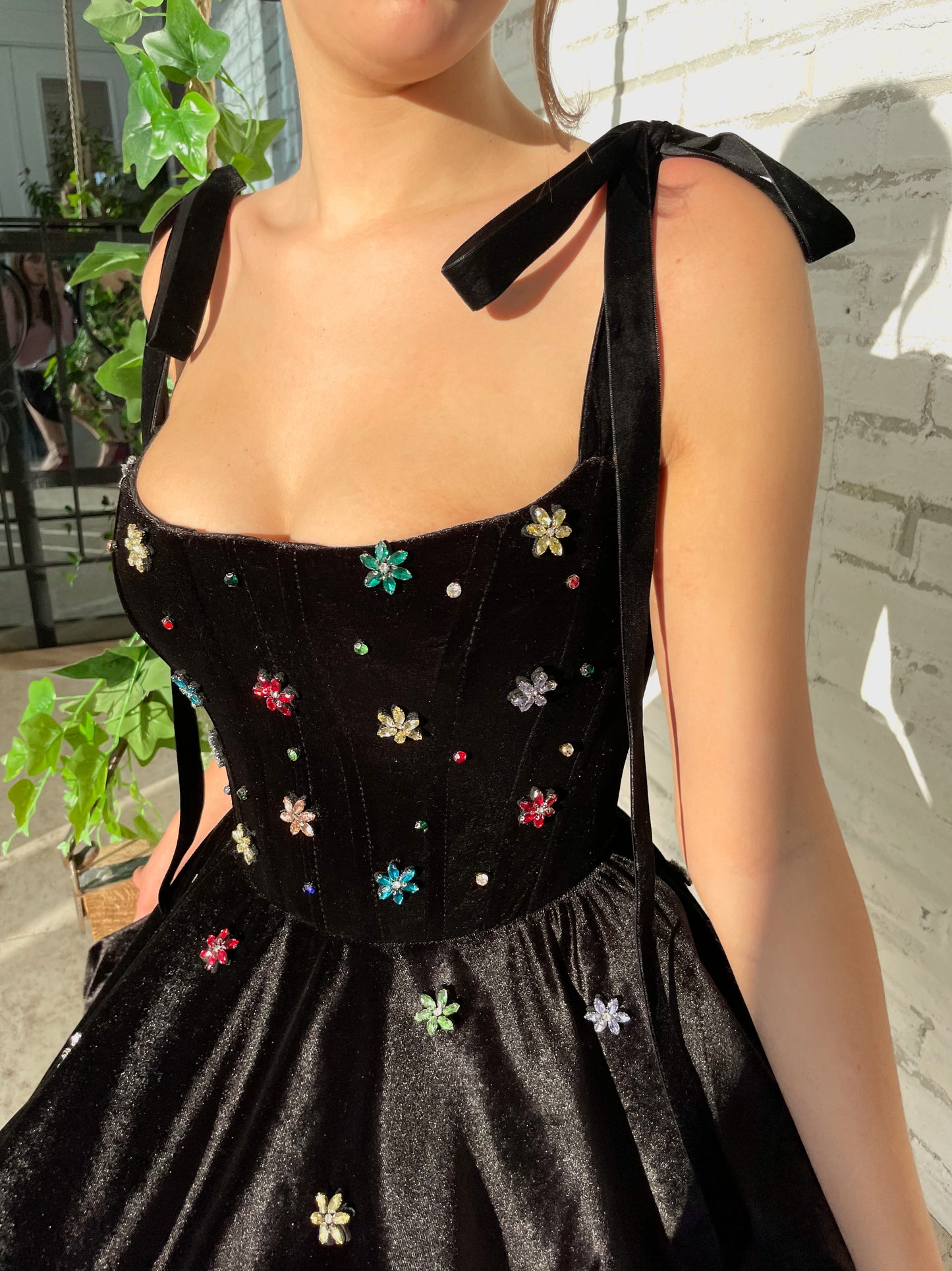 Black mini dress with bow straps and embroidery