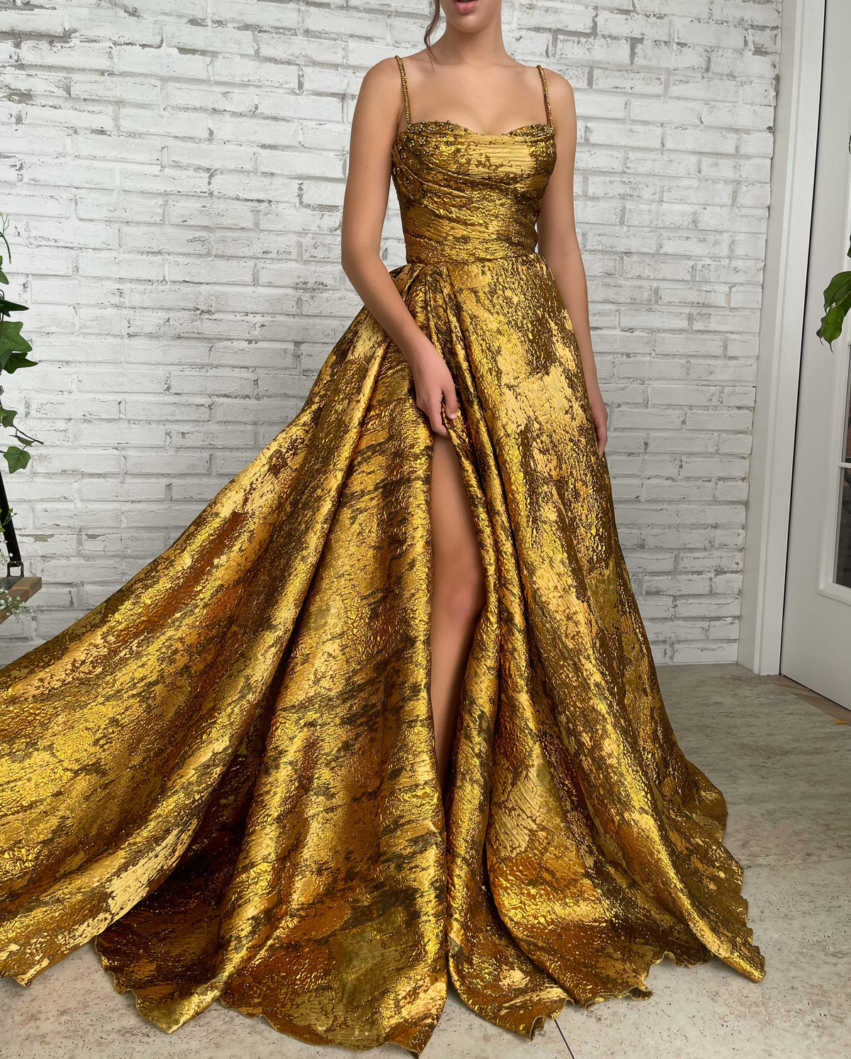 Gold A-Line dress with spaghetti straps and beading