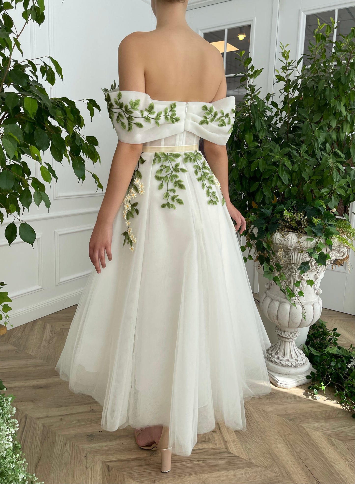 Midi white bridal dress with off the shoulder sleeves and embroidered vines and flowers